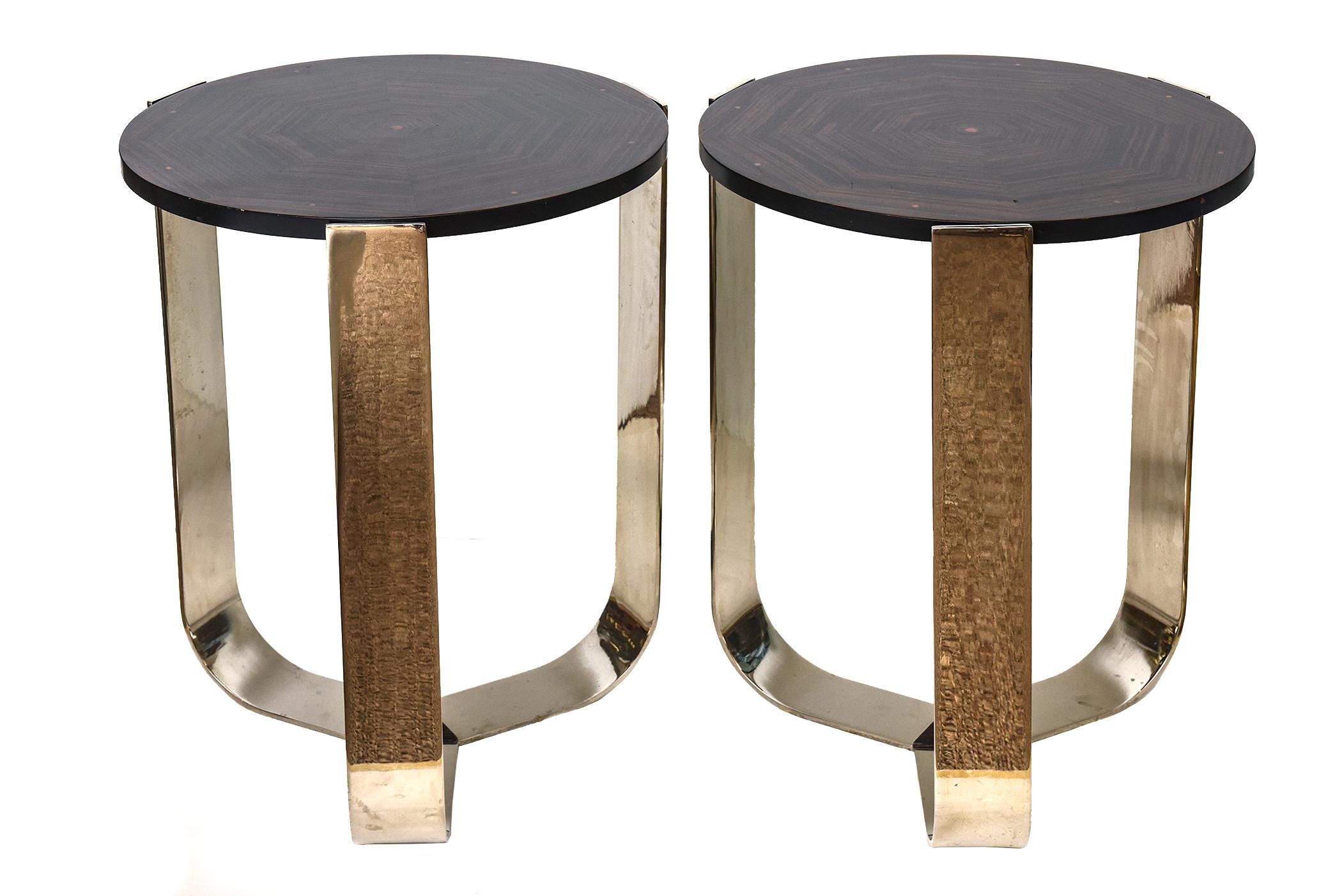 This pair of handsome art deco style and influenced side/ end tables are chrome plated stainless steel with a combination of rosewood high gloss polish tops. The web swirl design of the rosewood has inlaid other wood of a copper like color of