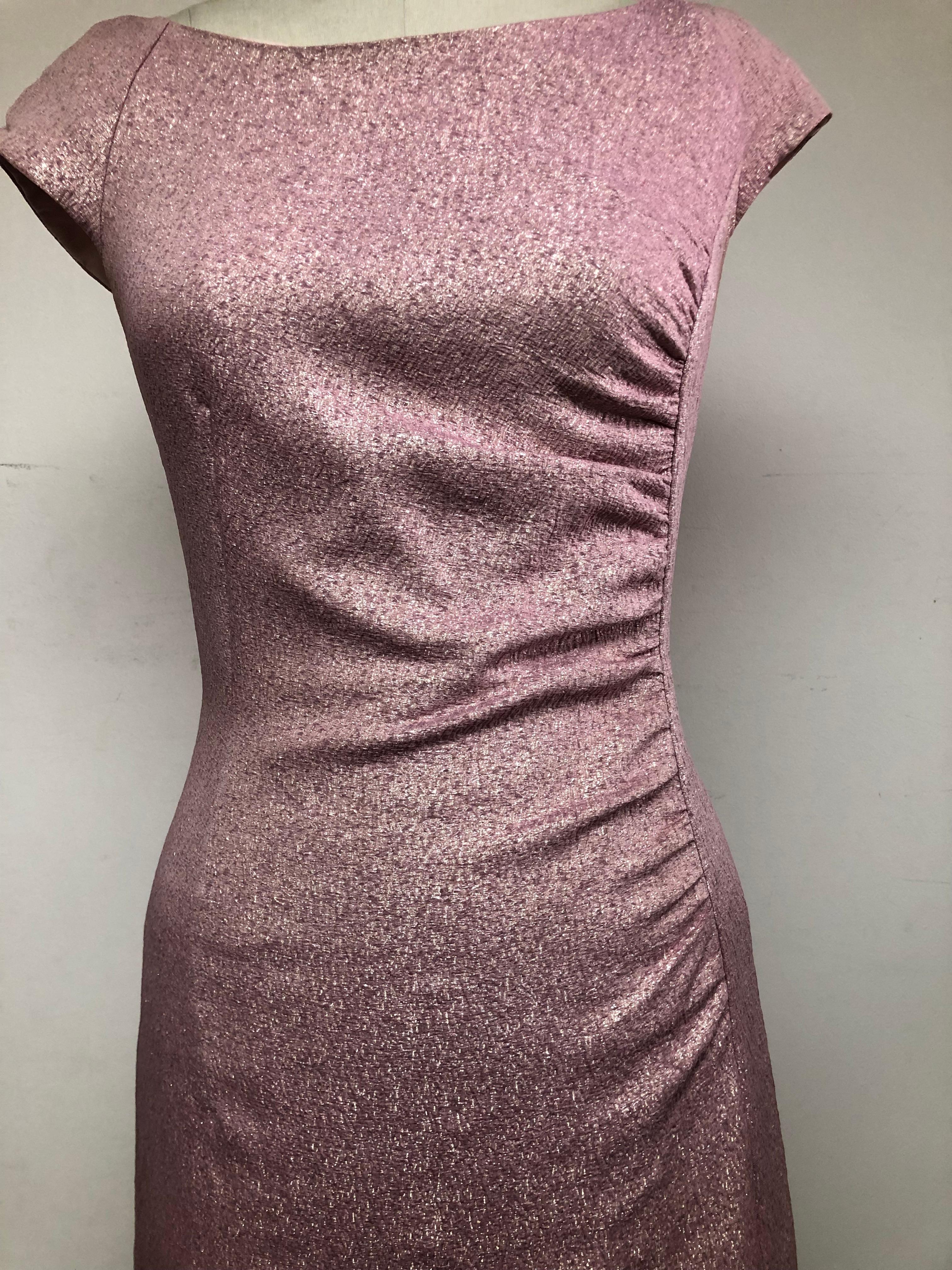 This is loveliest sparkly pink French crepe gown.  The gown is 
very flattering and figure hugging with side ruching and a  slit for showing some leg. The perfect packable gown. The textile is from the illustrious  French mill Sfate and Combier.
