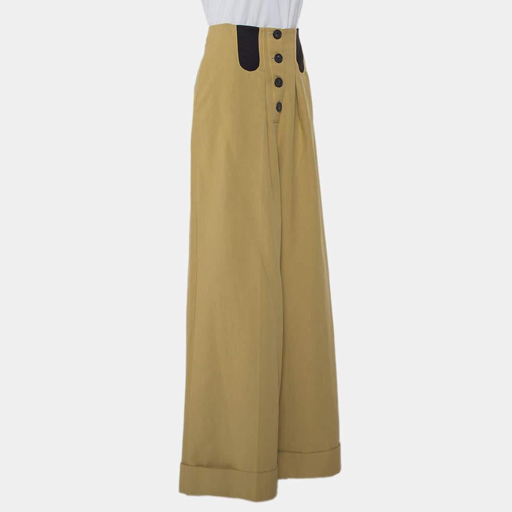 These palazzo pants from Rosie Assouiin are effortlessly chic and project an urbane look! They are made from cotton and feature a high-waist. They come equipped with button fastening and will seamlessly assist you in making your everyday looks stand