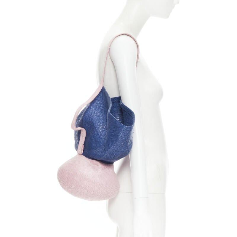 ROSIE ASSOULIN Jug sculptural pink blue flared raffia woven basket bag
Reference: TGAS/B01190
Brand: Rosie Assoulin
Material: Straw
Color: Pink, Blue
Pattern: Solid
Estimated Retail Price: USD 900
Made in: United States

CONDITION:
Condition: Unworn