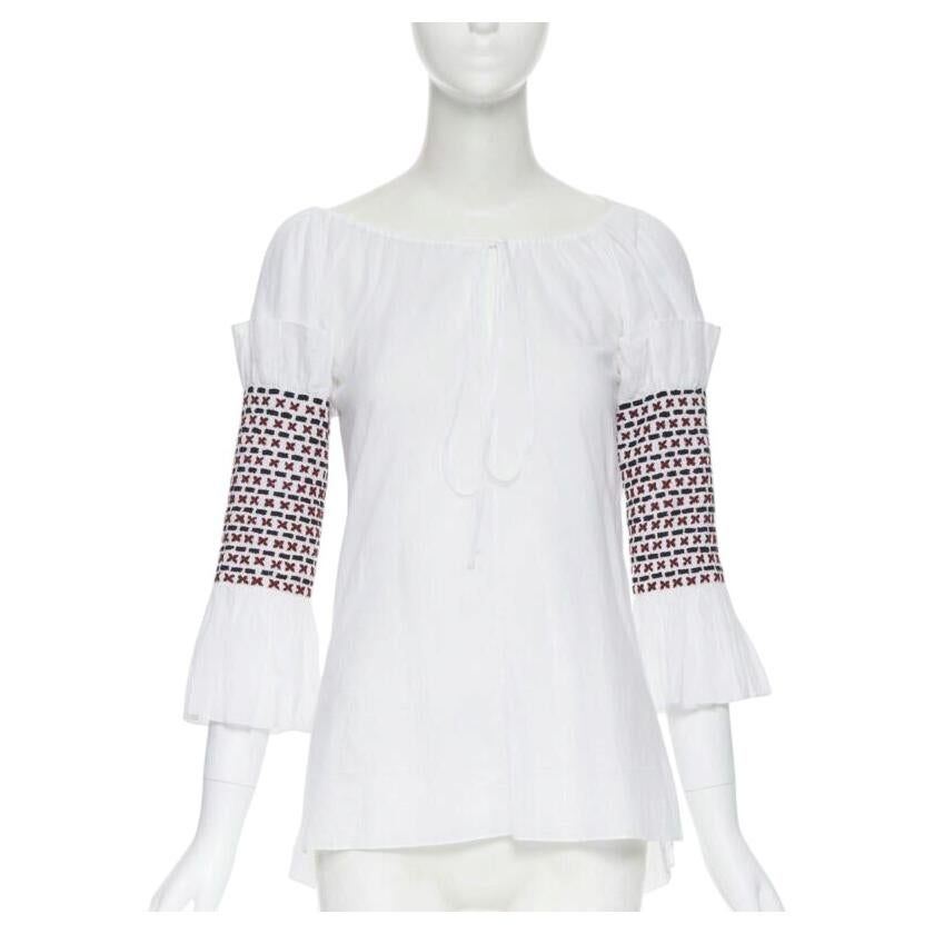 ROSIE ASSOULIN white ethnic embroidery smocked sleeves off shoulder top US0 For Sale