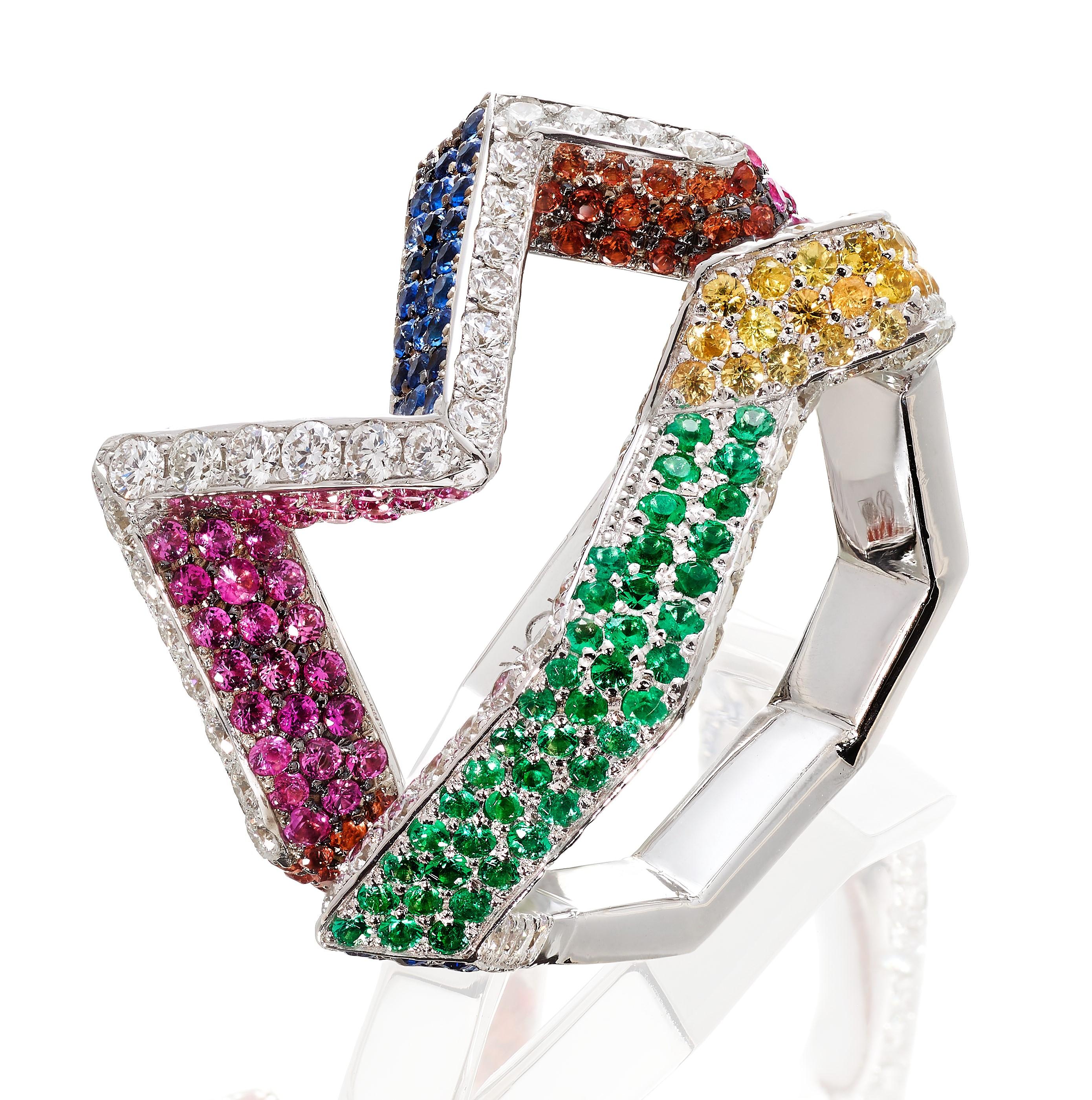Rosior Contemporary Cocktail Ring set in White Gold with:
- 85 F Color, VVS Clarity Diamonds with 0,79 ct;
- 42 Emeralds with 0,18 ct;
- 52 Pink Sapphires with 0,34 ct;
- 54 Blue Sapphires with 0,30 ct;
- 16 Purple Sapphires with 0,07 ct;
- 85