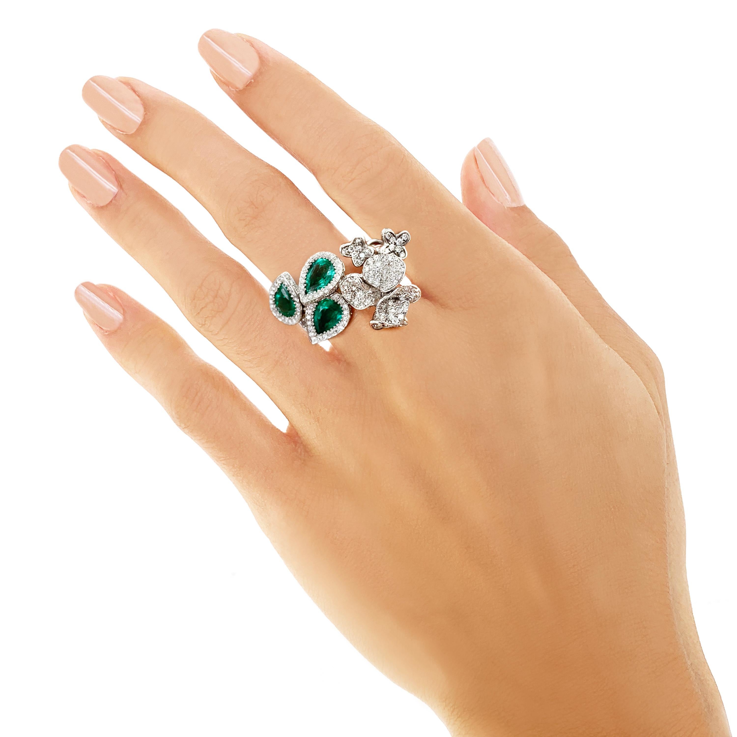 Rosior by Manuel Rosas 19.2K Contemporary White Gold Cocktail Ring set with:
- 3 Pear Cut Zambian Emeralds with 1,92 ct,
- 278 White (G-VVS) Diamonds with 1,46 ct.
Sizable.
This unique piece comes with a Certificate of Authenticity. 
Stamps include