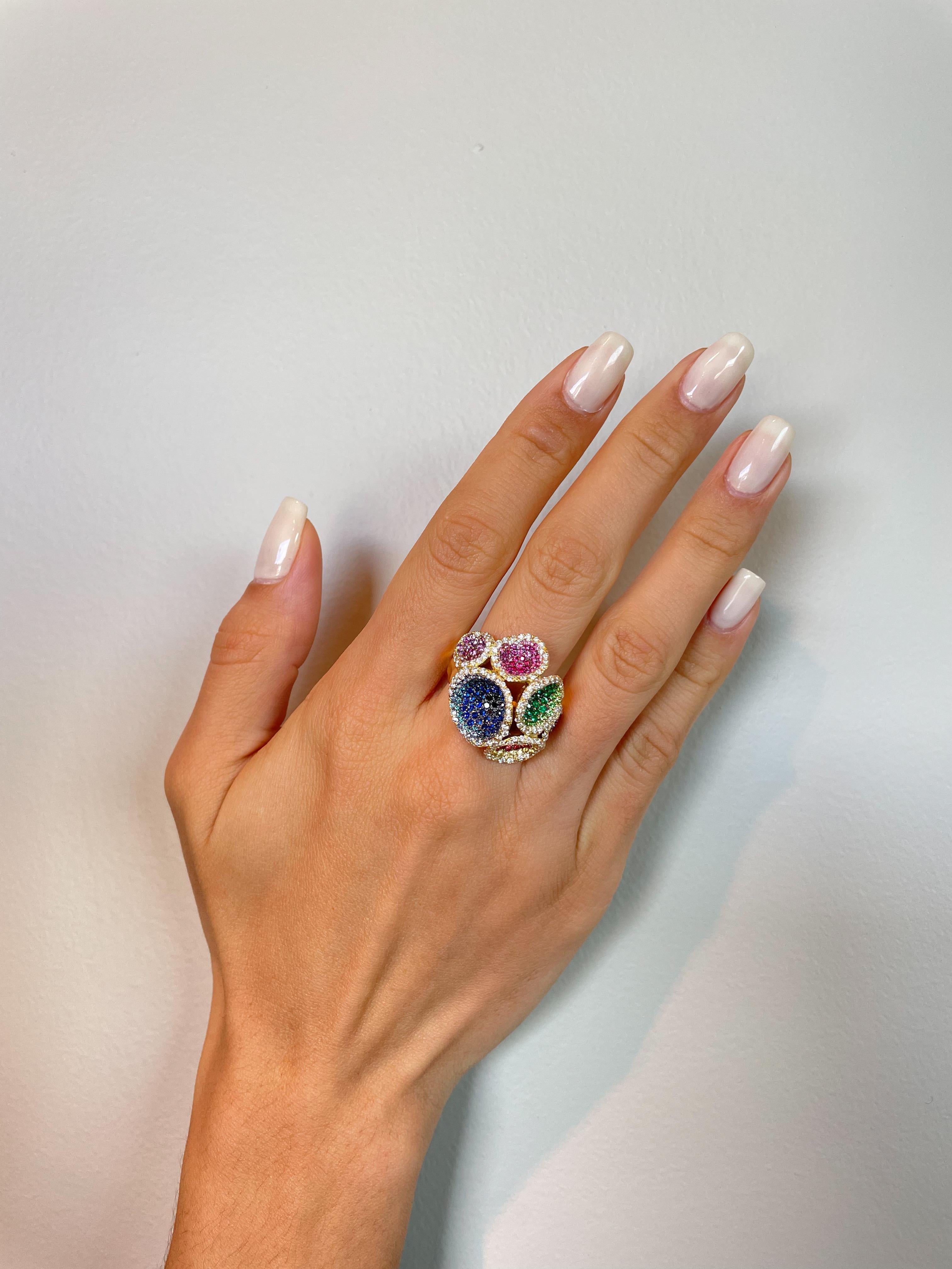 Rosior Contemporary Cocktail Ring featuring different size Corals made in Yellow Gold and set with:
- 214 Colorless (F color, VVS clarity) Diamonds with 1,07 ct;
- 80 Blue Sapphires with 0,77 ct;
- 63 Purple Sapphires with 0,55 ct; 
- 42 Pink