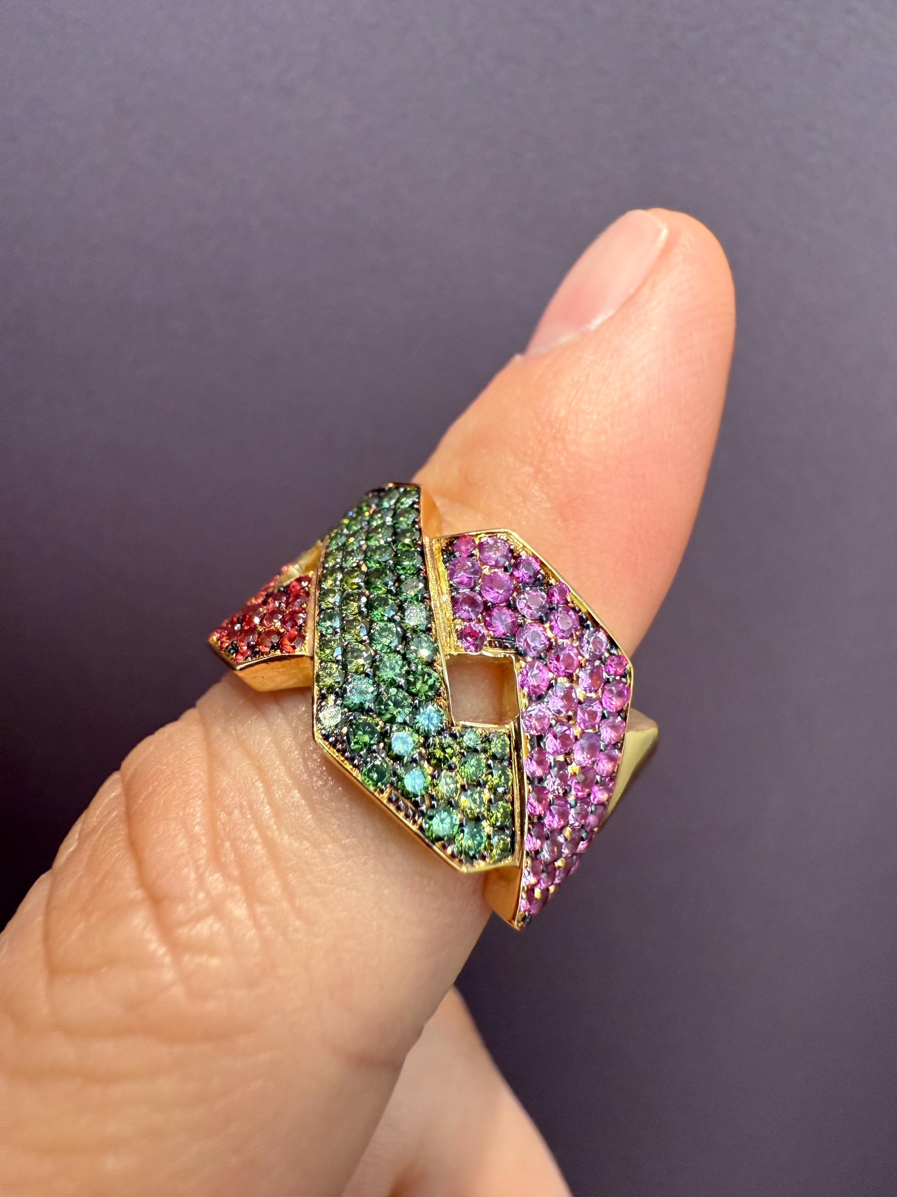 Rosior one-off Cocktail Ring set in Yellow Gold with:
- 61 green diamonds weighing 0,72 ct;
- 54 pink sapphires weighing 0,88 ct;
- 58 orange sapphires weighing 0,89 ct.
Weight in 19,2k gold: 10,8 g.
Unique piece.
Stamped by the portuguese assay