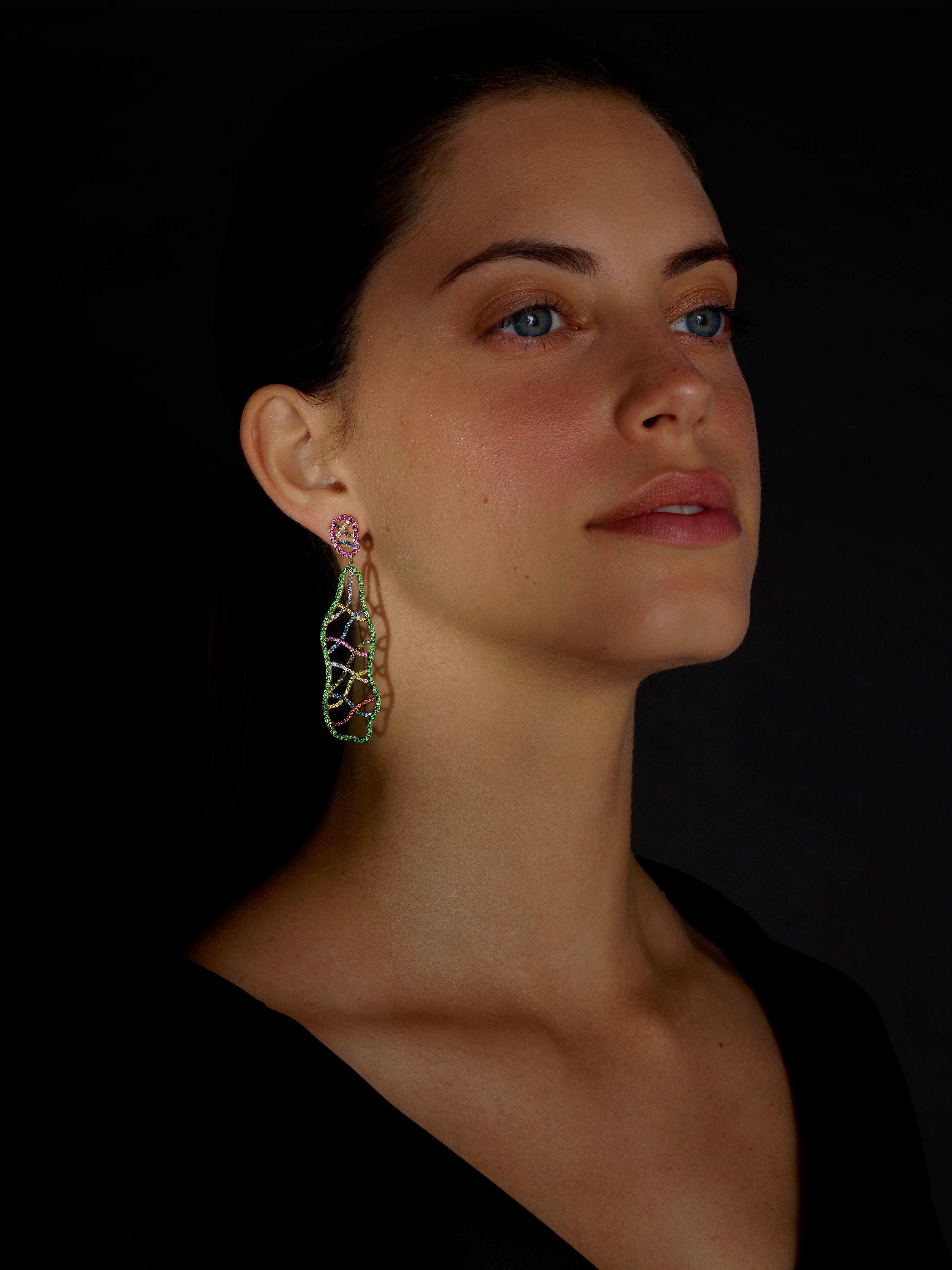 Long and assymetric Dangle Earrings set in Yellow Gold by Rosior. These earrings are set with:
- 122 pink sapphires weighing 1,55 ct;
- 112 tsavorites weighing 1,28 ct; 
- 50 diamonds (F color, VVS clarity) weighing 0,25 ct;
- 47 blue sapphires