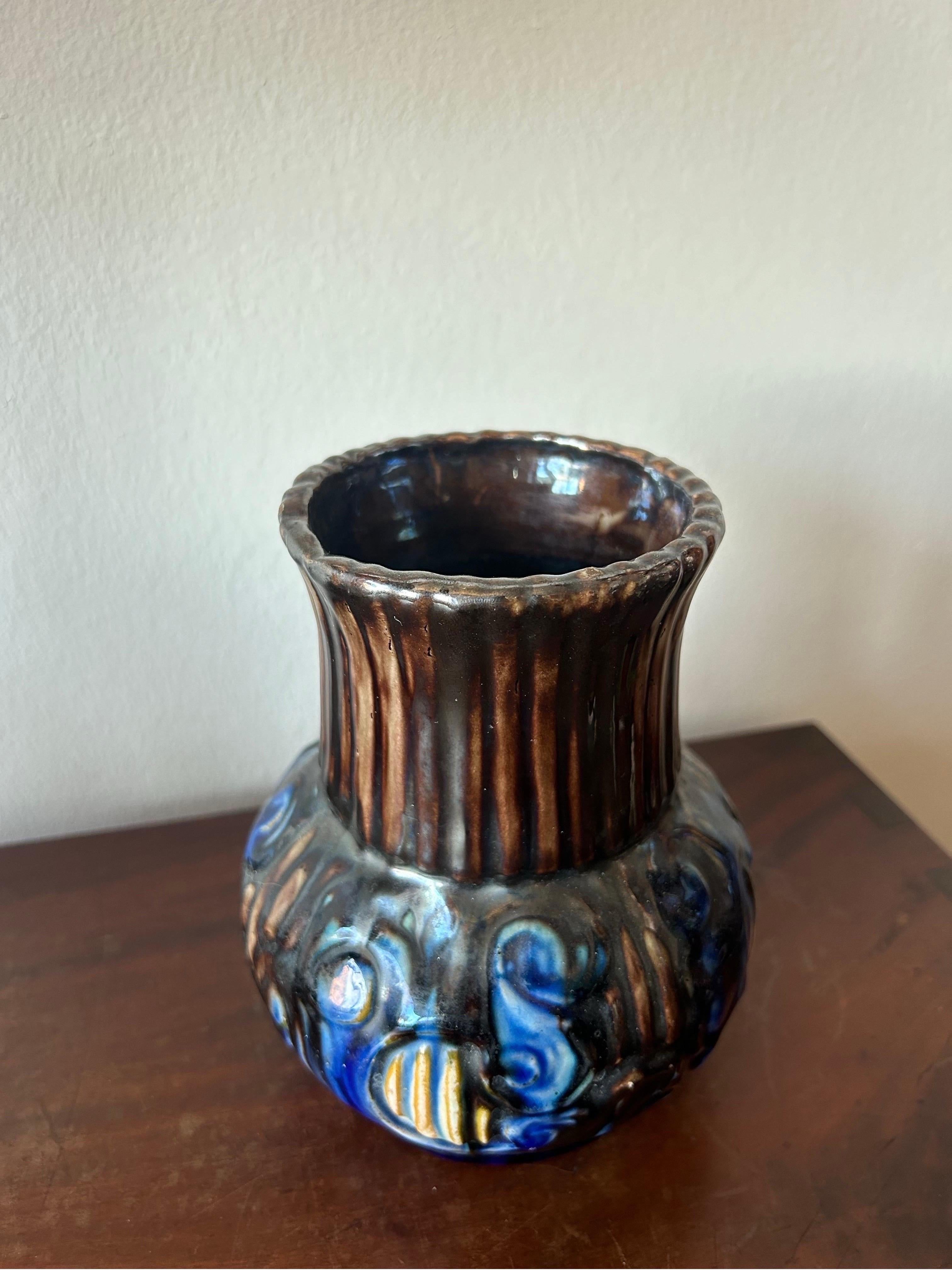 Roskilde Lervare Fabrik vase manufactured by a well known but very undocumented factory called Roskilde Lervare Fabrik in Denmark in the early 1900’s.
This specific vase is marked with the number 66.
The vase has a very traditional Danish Arts and