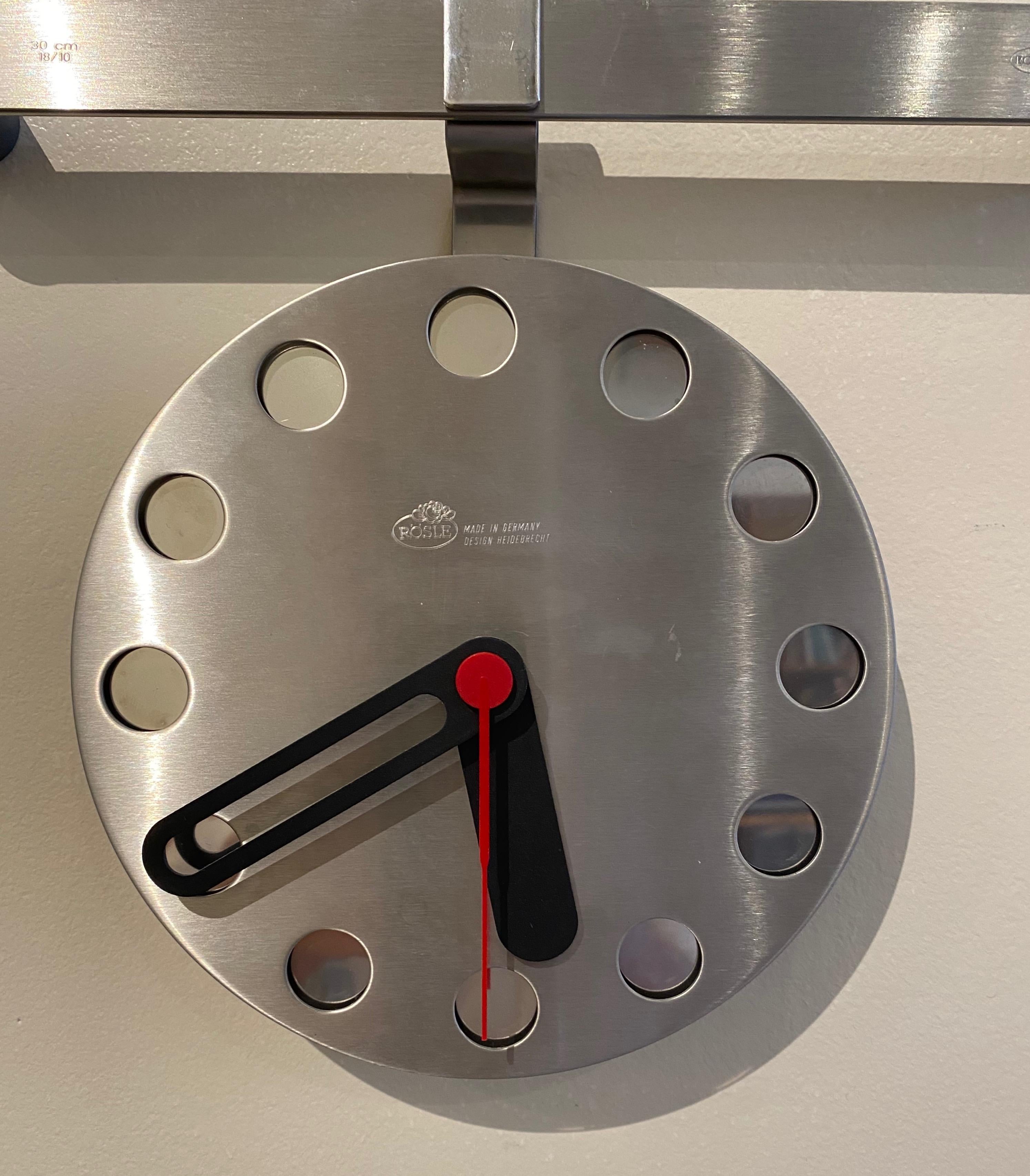 Stainless steel wall clock by Rosle Metallwarenfabrik of Germany, created by Heidebrecht Design. This design was part of the Rosle Kitchen rail system produced during the 1990s to early 2000s. A handsome modernist wall clock for the kitchen or other