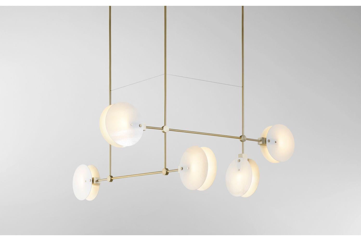 The Nebulae Collection takes its name from the natural phenomena of interstellar clouds and their dynamic layered lighting effects. The geometric machined forms coupled with the fluid glass discs create balance between the elements.

Designed for