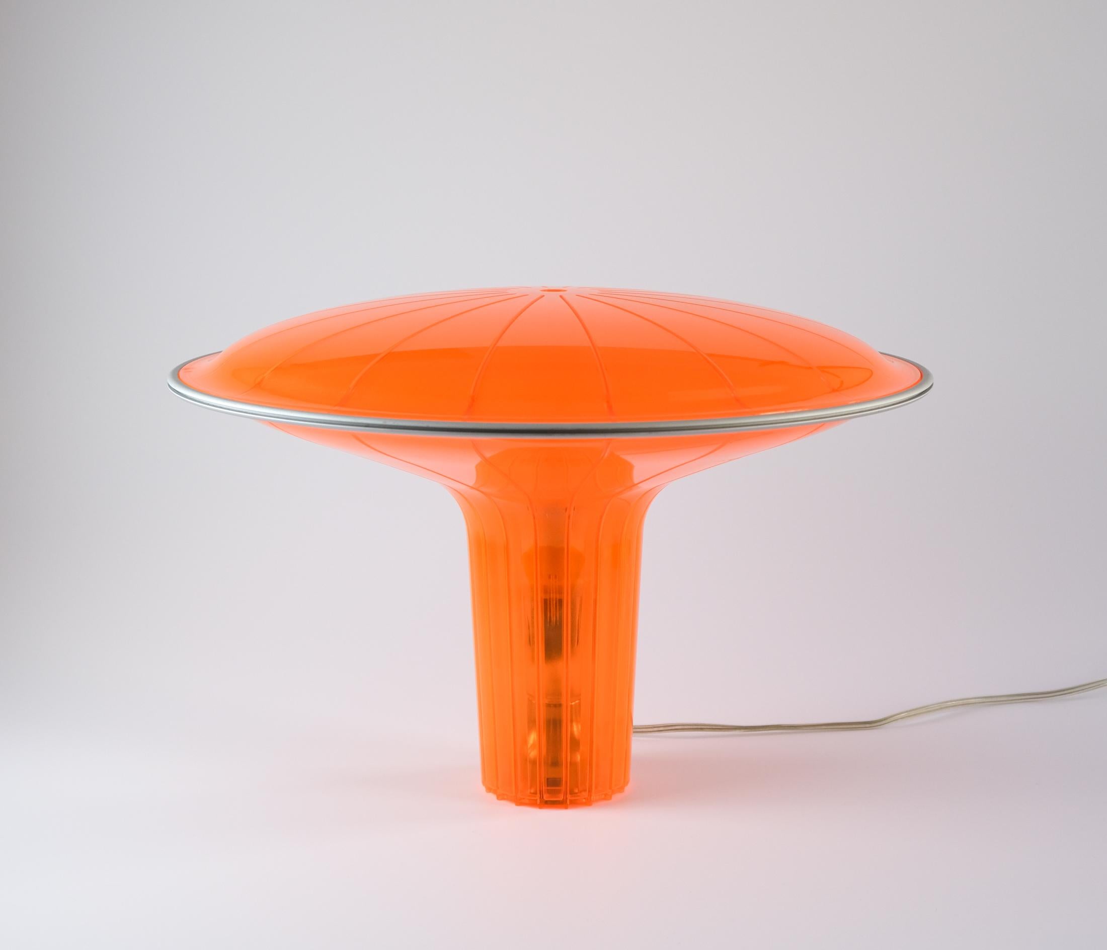 For sale is an iconic orange D36 “Agaricon” table lamp, designed by Ross Lovegrove in 1999 for LucePlan of Italy.

Light and semi-transparent, the Agaricon (Greek for mushroom) is switched on and off by touching an aluminium sensor ring that runs