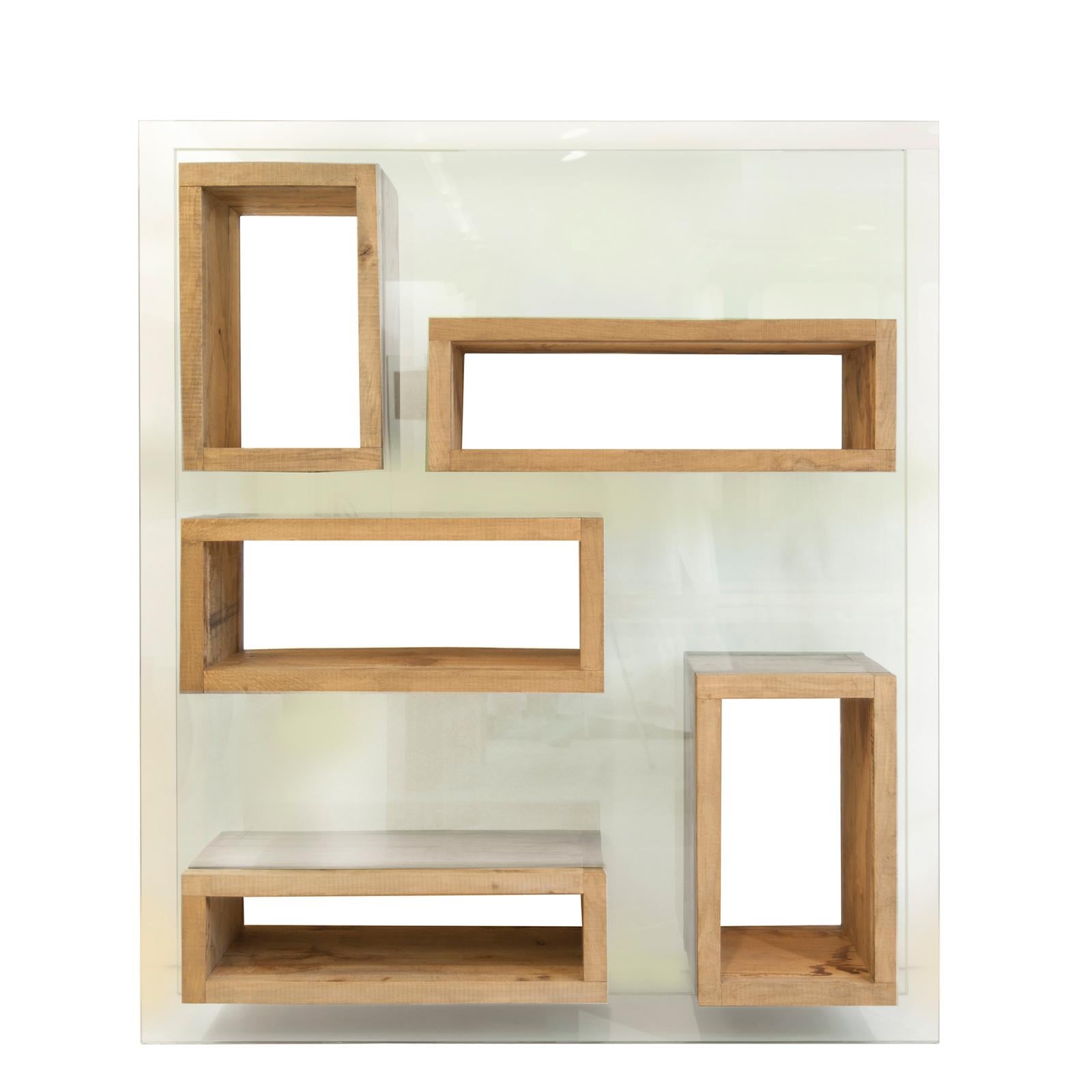 Designed by Matteo Casalegno

“Volumi Sospesi” is a beautiful bookcase made in antique wood and glass. It has pure and minimal, geometrical forms and can be used in 2 dimensions: in front and from a side.

Available in different size.