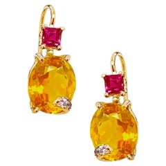 Rossella Ugolini, boucles d'oreilles en or jaune 18 carats, rubis et diamants blancs 0,50 carat