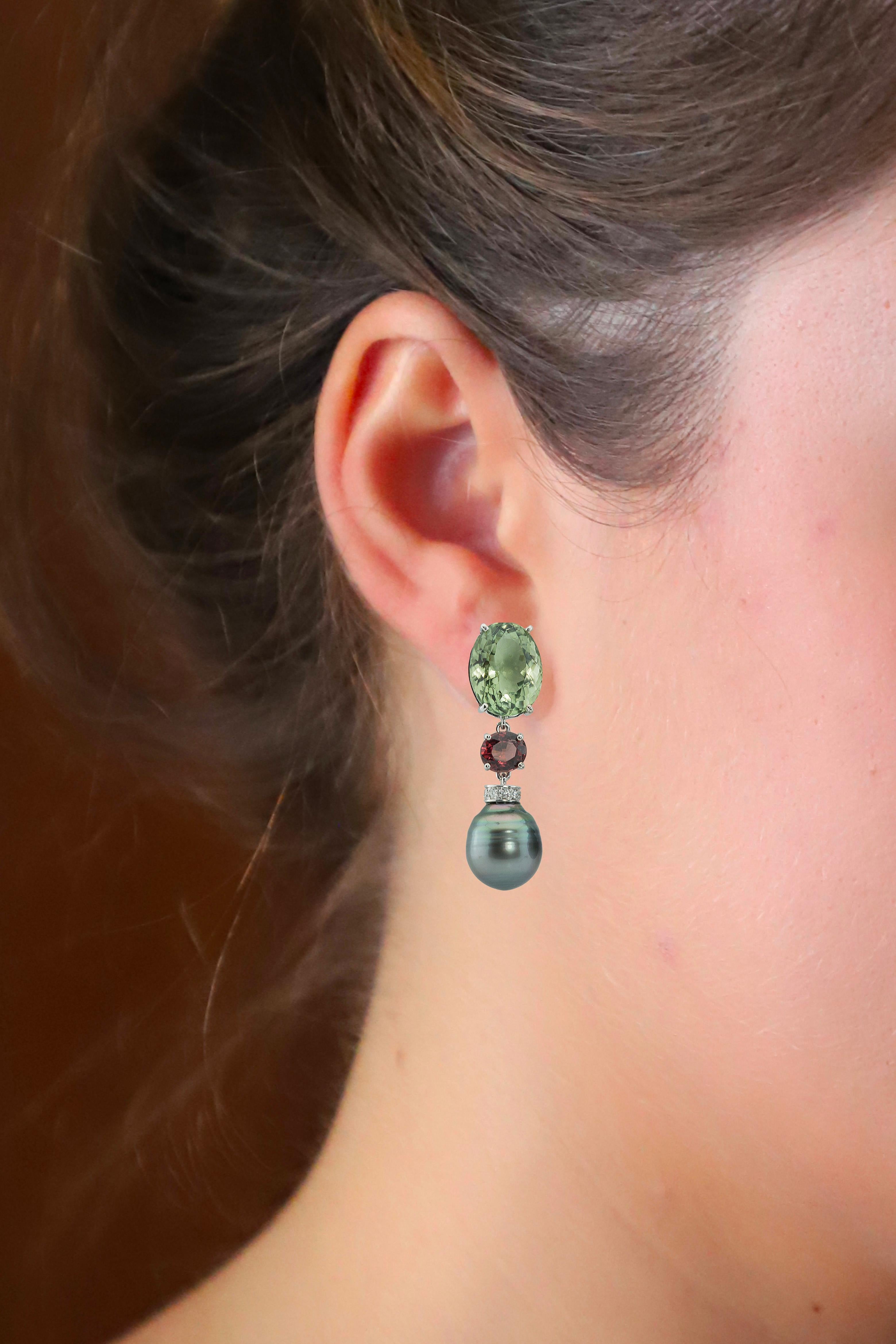 Introducing the exquisite Rossella Ugolini drop earrings, meticulously crafted in Italy from luxurious 18K white Gold, adorned with Mint Green Amethyst ,Garnet, White Diamonds and Gray Pearls. 

Handcrafted for pierced ears, on each earring rests a