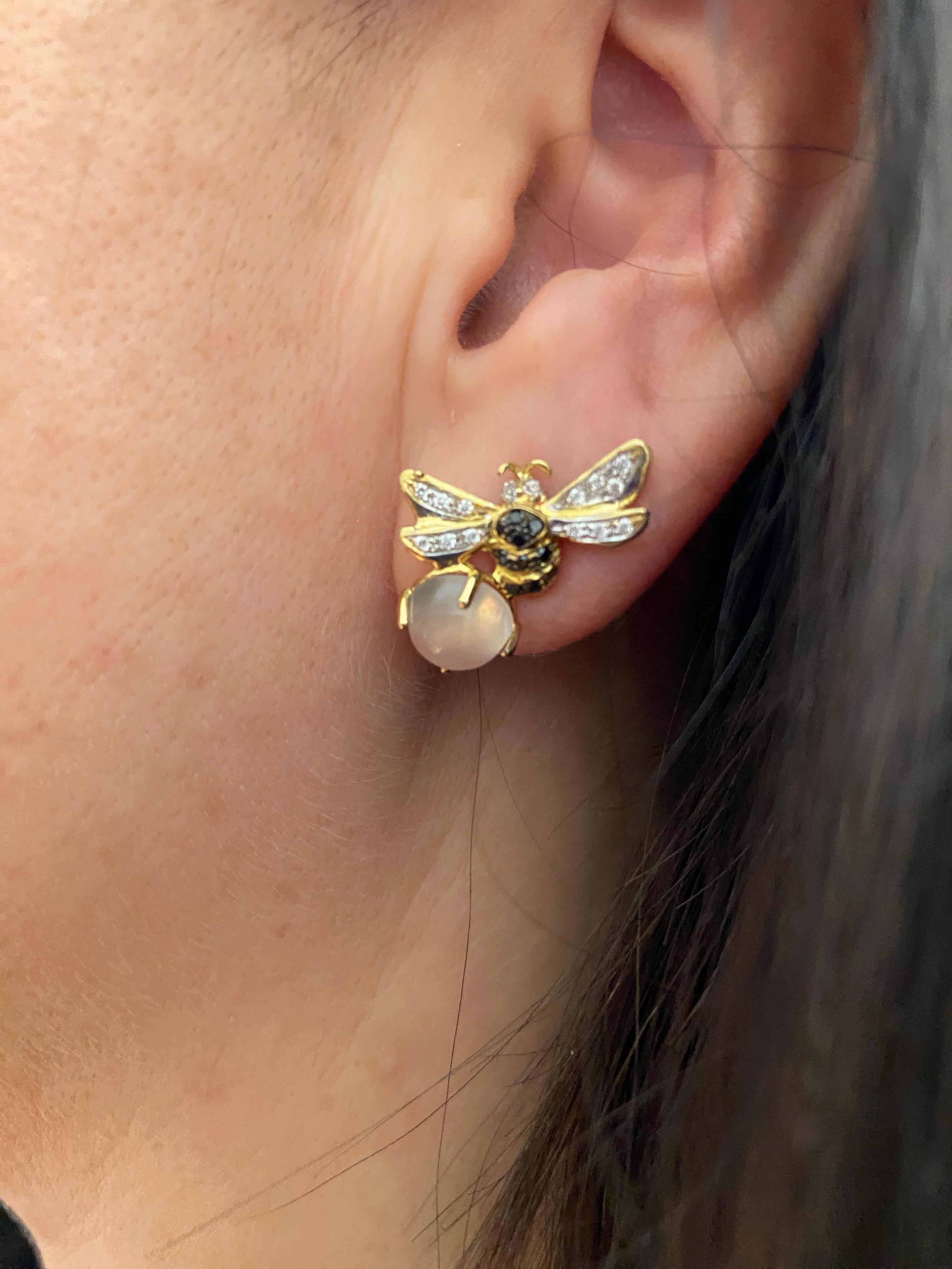 Rossella Ugolini's Bee Collection  a masterpiece of handmade elegance. These 18K Yellow Gold earrings, adorned with ct. 0,20 white Diamonds and 0.18 ct Black Diamonds, showcase the ancient lost wax technique, capturing the industrious essence of the