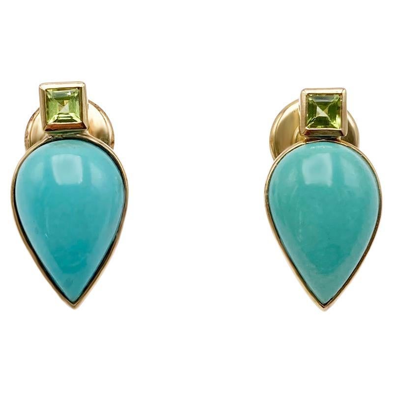These 18K yellow gold earrings by Rossella Ugolini encapsulate the vibrant essence of the Mediterranean, drawing inspiration from the enchanting landscapes and lively colors of Sicily and Sardinia. The harmonious combination of Peridot and Turquoise