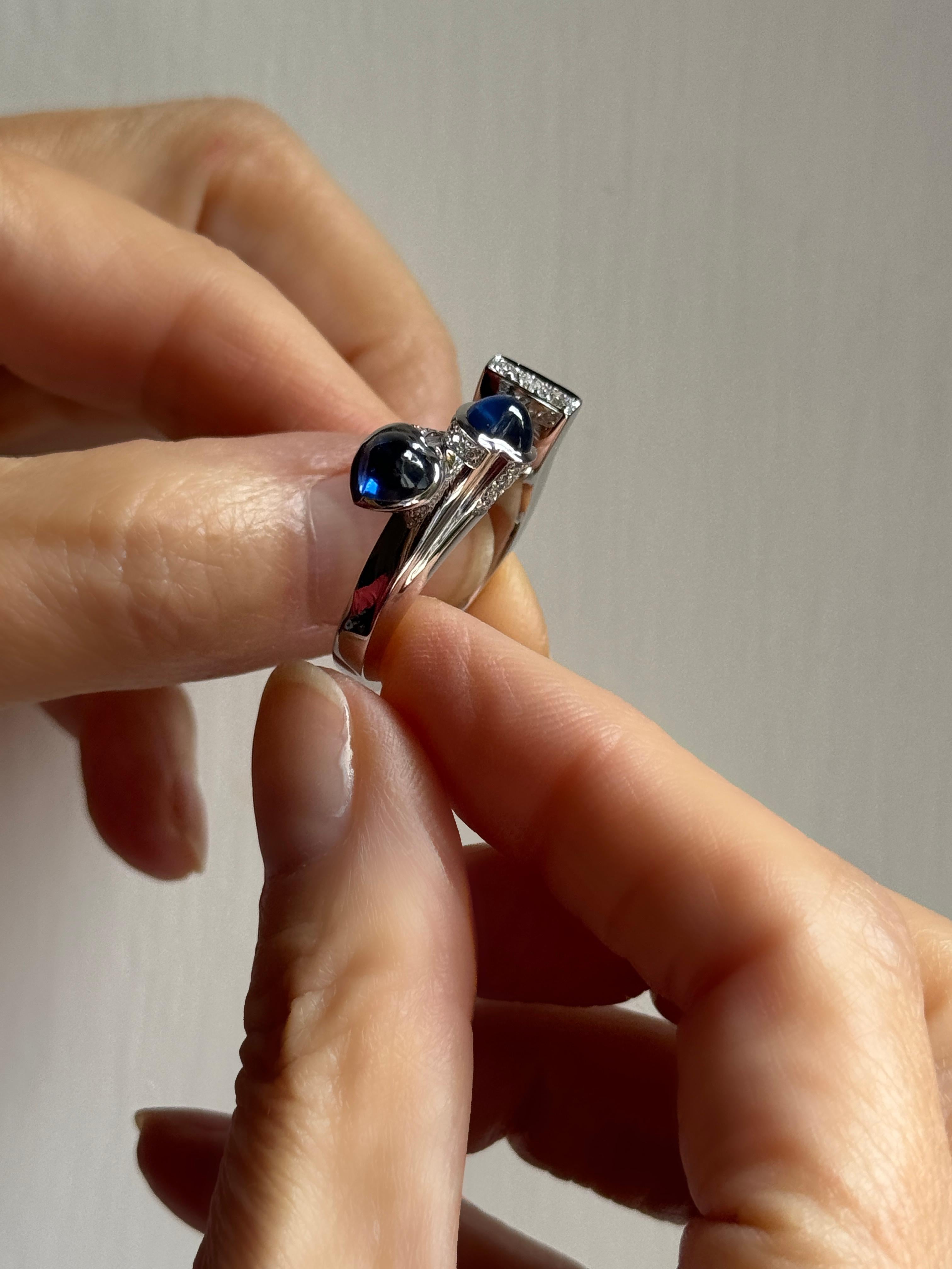 Rossella Ugolini 18K White Gold Heart Cut Sapphires White Diamonds Cocktail Ring. A superbly designed cocktail ring perfectly, handcrafted in Italy. 
Crafted in 18K gold, the surfaces interweave in a contemporary pattern, creating a striking and