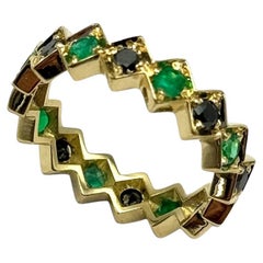 Rossella Ugolini: 18 Karat Gelbgold Ring mit 0,55 Karat Smaragden und schwarzen Diamanten