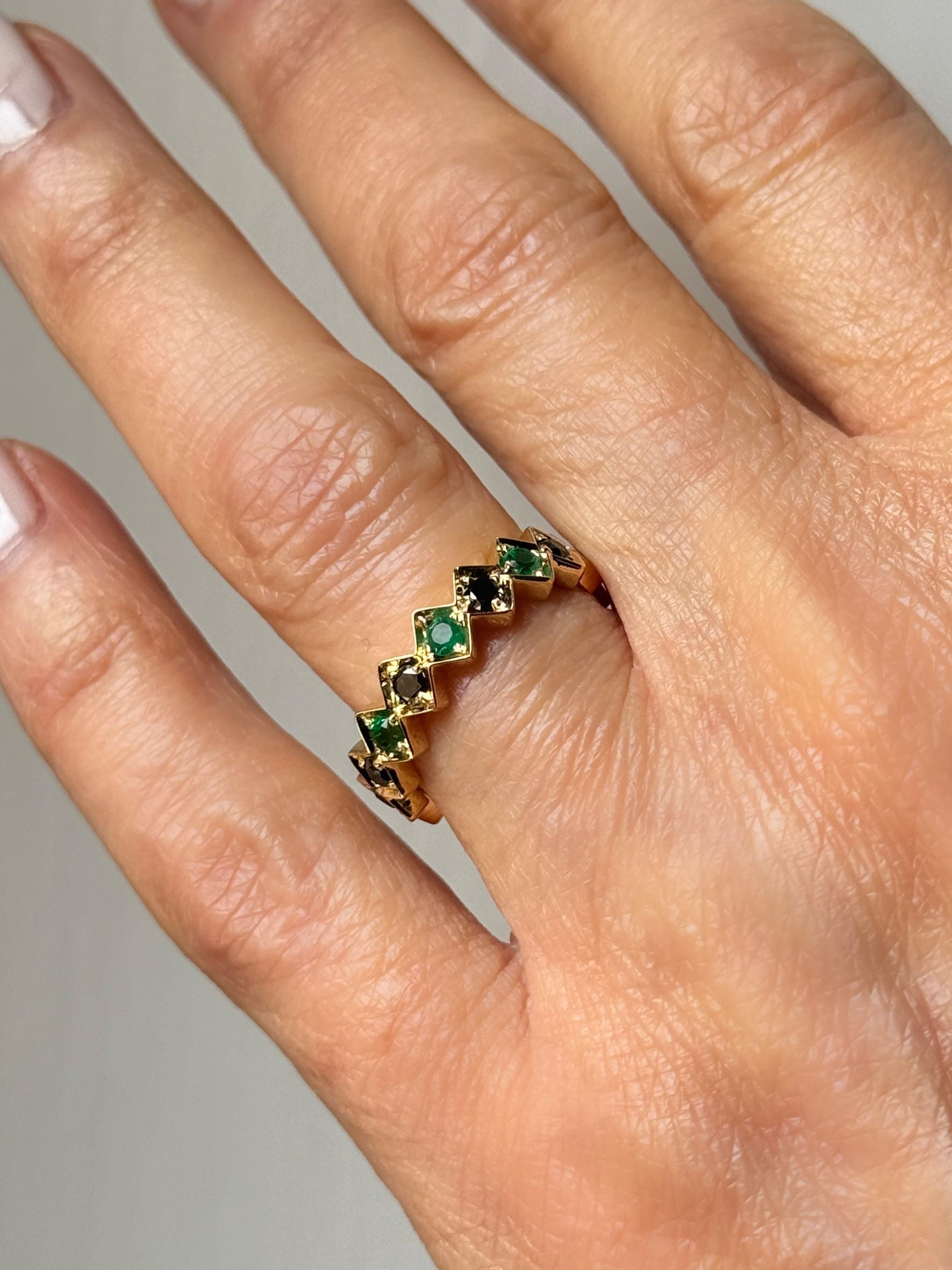 Rossella Ugolini 18K Yellow Gold 0,55 Carat Emeralds  0.59 carat Black Diamonds Band Man Ring Size 10.
The 18K Yellow Gold Band Ring is a refined piece of jewelry, handcrafted in Italy with Art Deco inspiration. It features a sequence of square