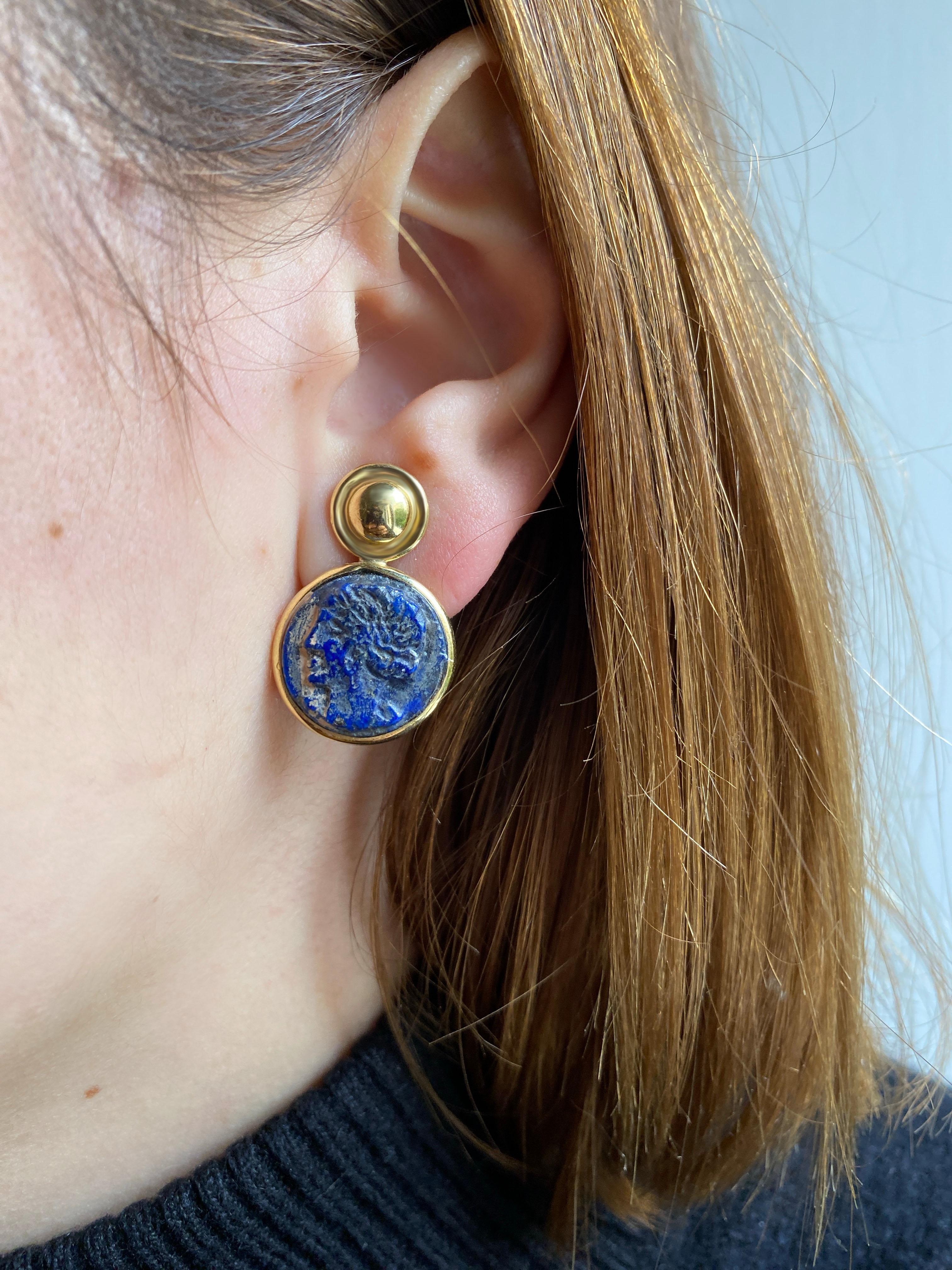 Rossella Ugolini 18k Yellow Gold Lapis Lazuli Carved Coin Cameo Clip-on Earrings Made in Italy.
Lapis lazuli and 18k yellow gold come together in these unique Etruscan Revival earrings, handcrafted in Rome, Italy. The design begins with a delicately