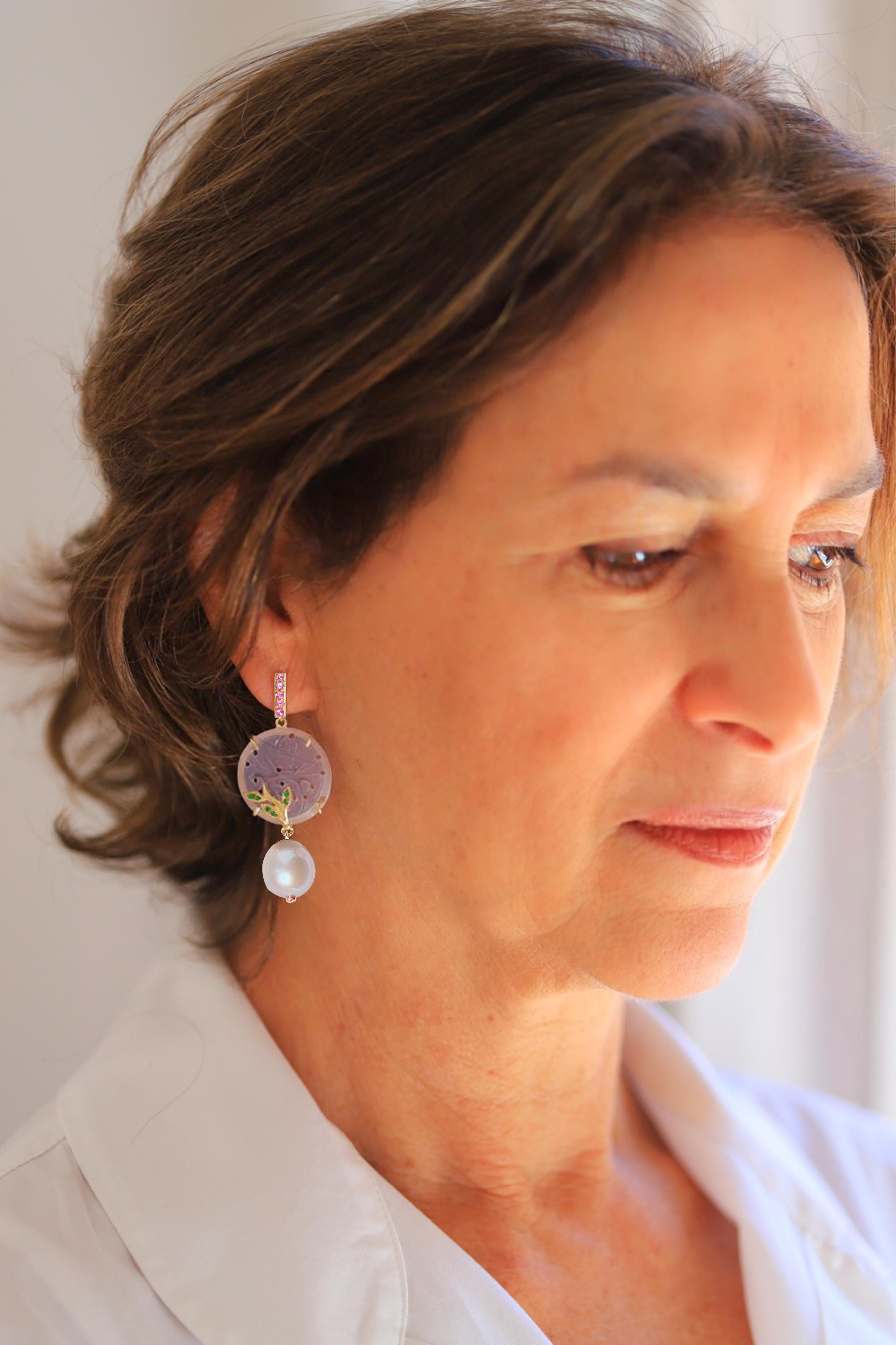 Rossella Ugolini 18K Yellow Gold Pink Sapphires Lilac Carved Coin Quartz White Diamonds, Green Tzavorite leafs Drops Earrings. Measuring 1.88 inches (4.8 cm ) in length, the earrings begin with a 18k yellow gold refined bar set with pink sapphires