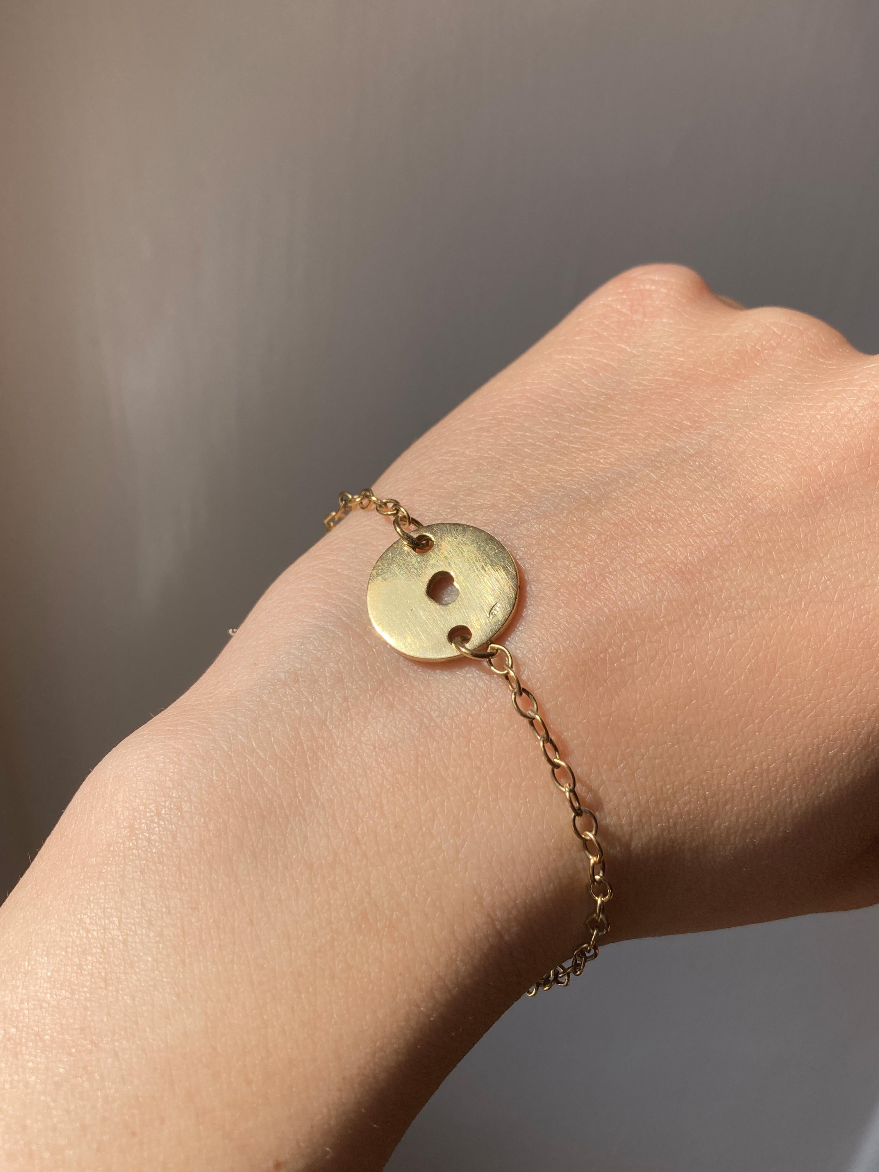 Rossella Ugolini 24K Yellow Gold Plated Silver Sterling Love chain Bracelet.  
Rossella Ugolini's 24K Yellow Gold Plated Sterling Silver Love Chain Bracelet is a beautiful expression of affection and elegance. 
Crafted in Italy, this bracelet