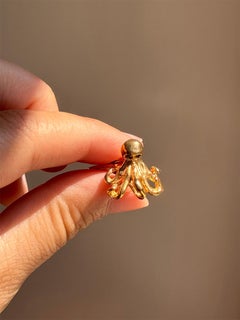 Rossella Ugolini Gemelos de pulpo con ojos de zafiro azul chapados en oro amarillo de 24k