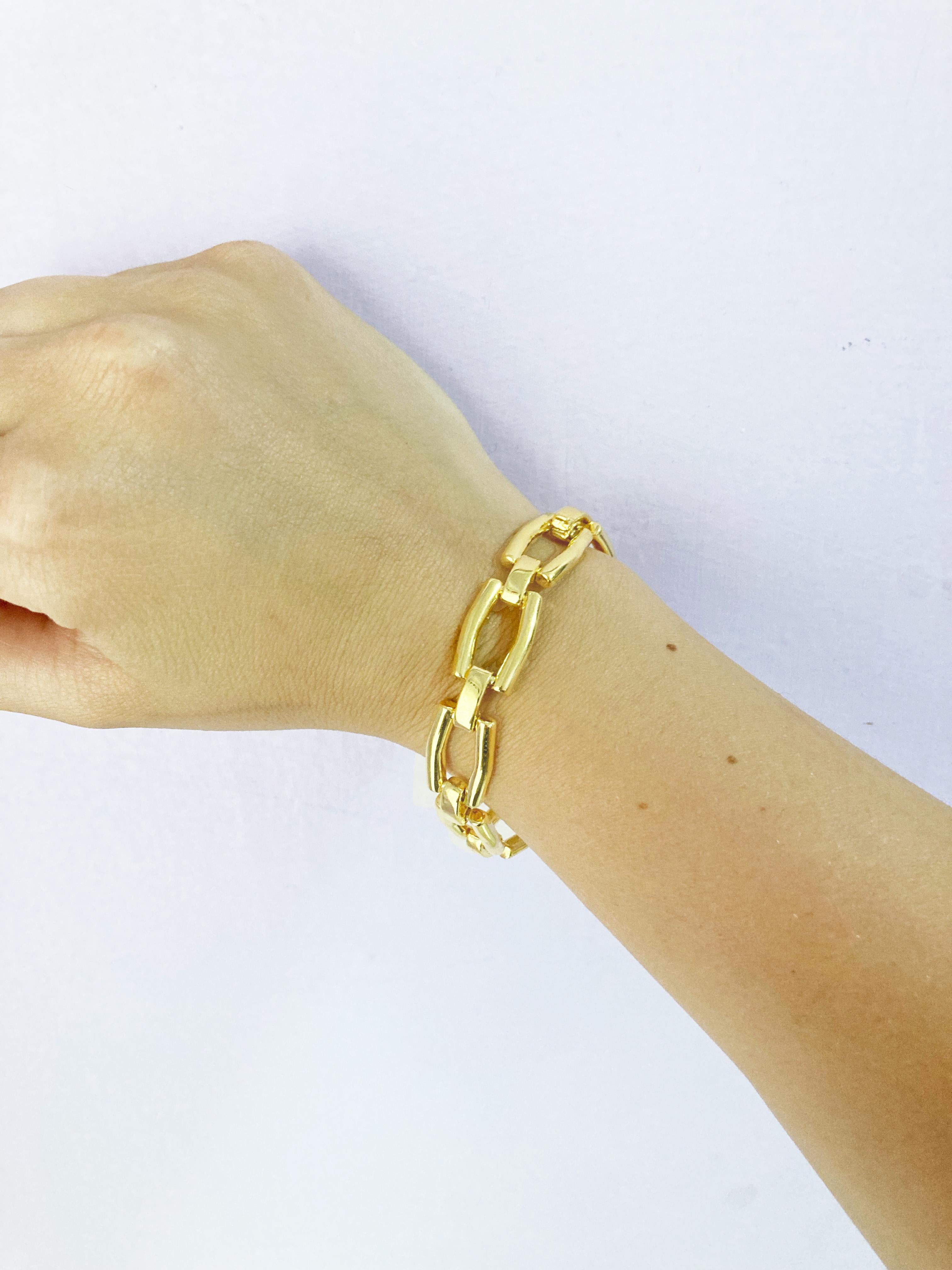 Elevate your style with the exquisite Rossella Ugolini Italian Design Modern Bracelet, a manifestation of contemporary luxury in Silver Sterling 24K Yellow Gold plated . Meticulously handcrafted, this bracelet features eight rectangular handmade
