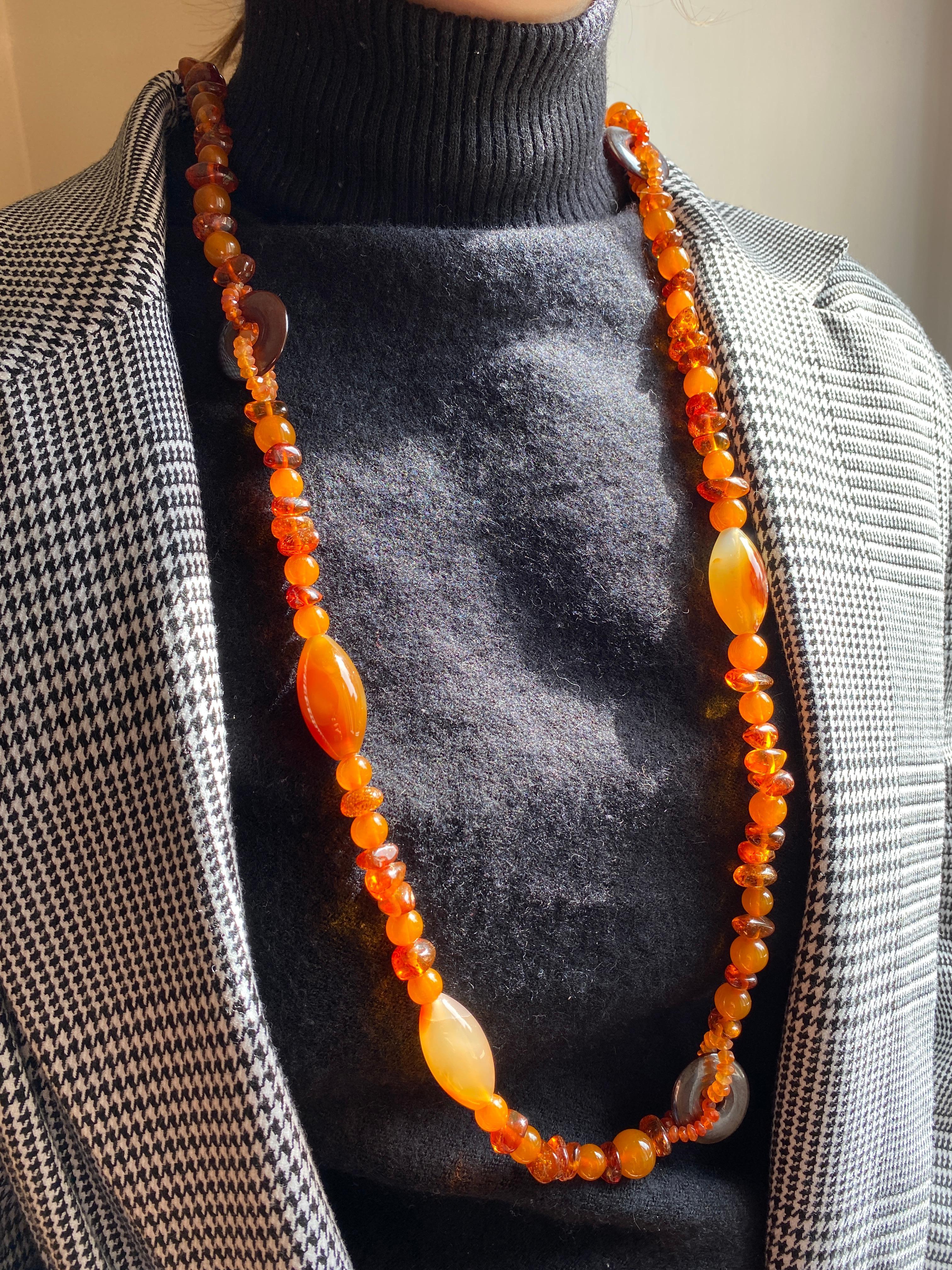Rossella Ugolini Handcrafted Amber, Carnelian, Agate, long beaded necklace Made in Italy. One-Of-A-Kind beaded necklace ready to ship. 
Dimensions: lenght 43 in ( 110 cm) 
This  necklace is handcrafted to be to warmth and intricacy, designed to be