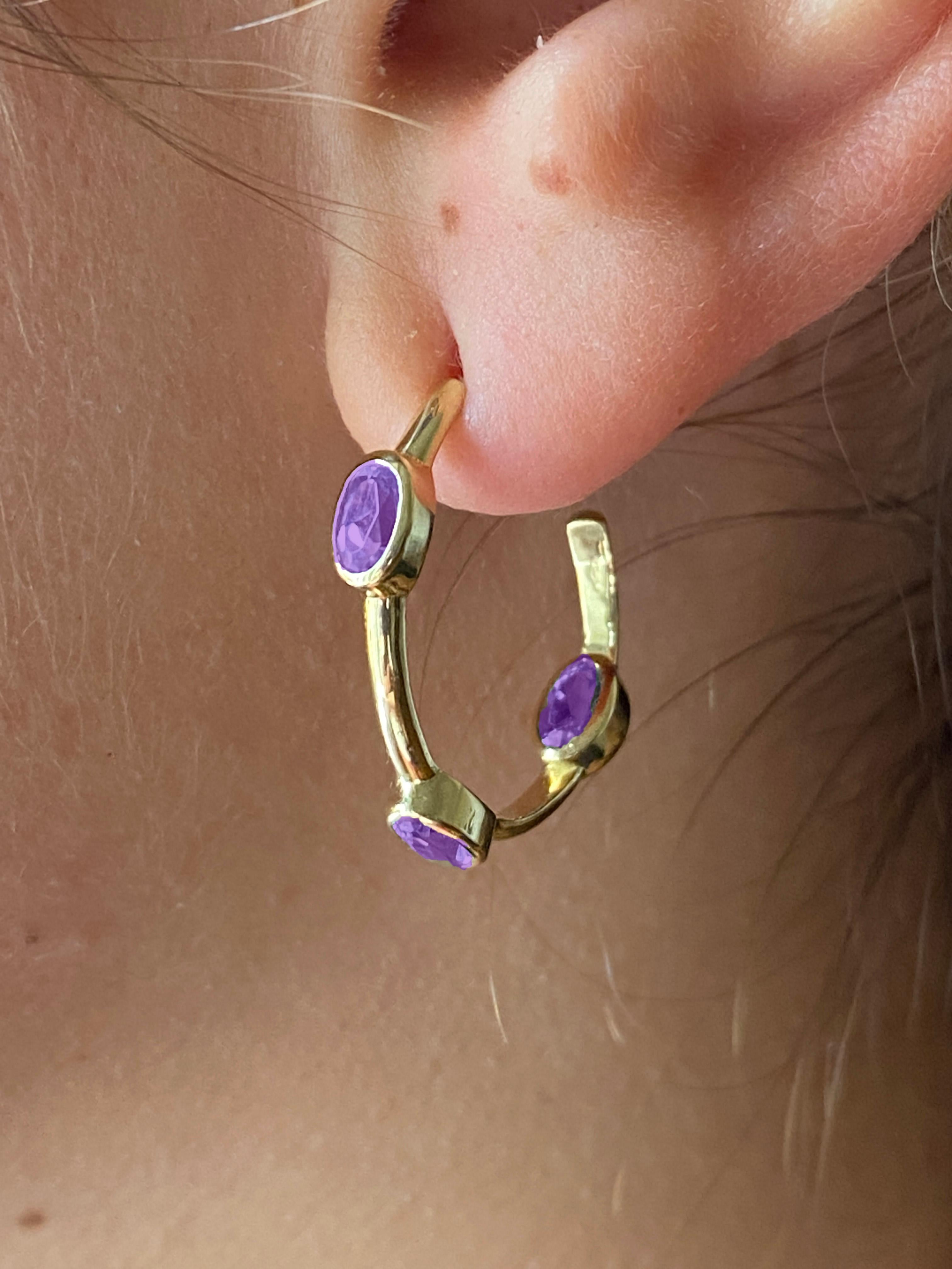 Discover the allure of Rossella Ugolini's Unisex Amethyst Hoop Earrings, a testament to the fine craftsmanship of Italy. These earrings effortlessly combine everyday elegance with a touch of opulence.

Each hoop, with a generous 2 cm diameter,