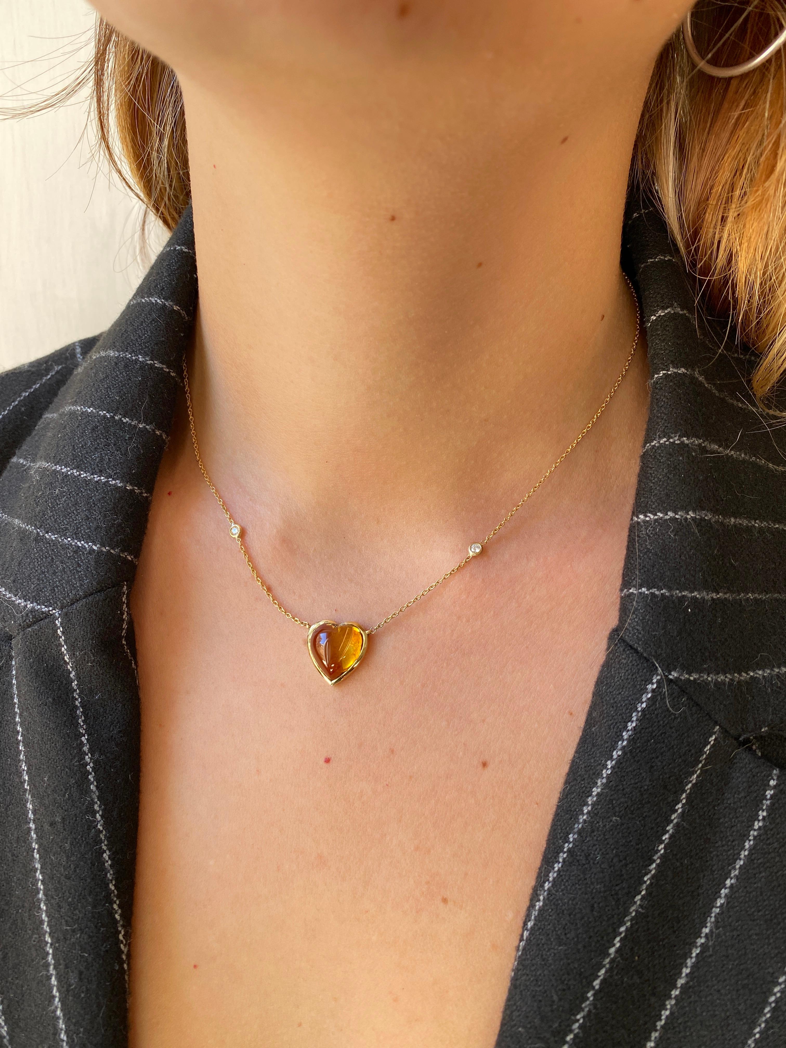 Ready to ship. Introducing the Handmade Rossella Ugolini Design Collection, this 18K Yellow Gold necklace is an embodiment of timeless elegance. The focal point of this necklace is a stunning yellow Citrine stone, carefully cut into a domed heart