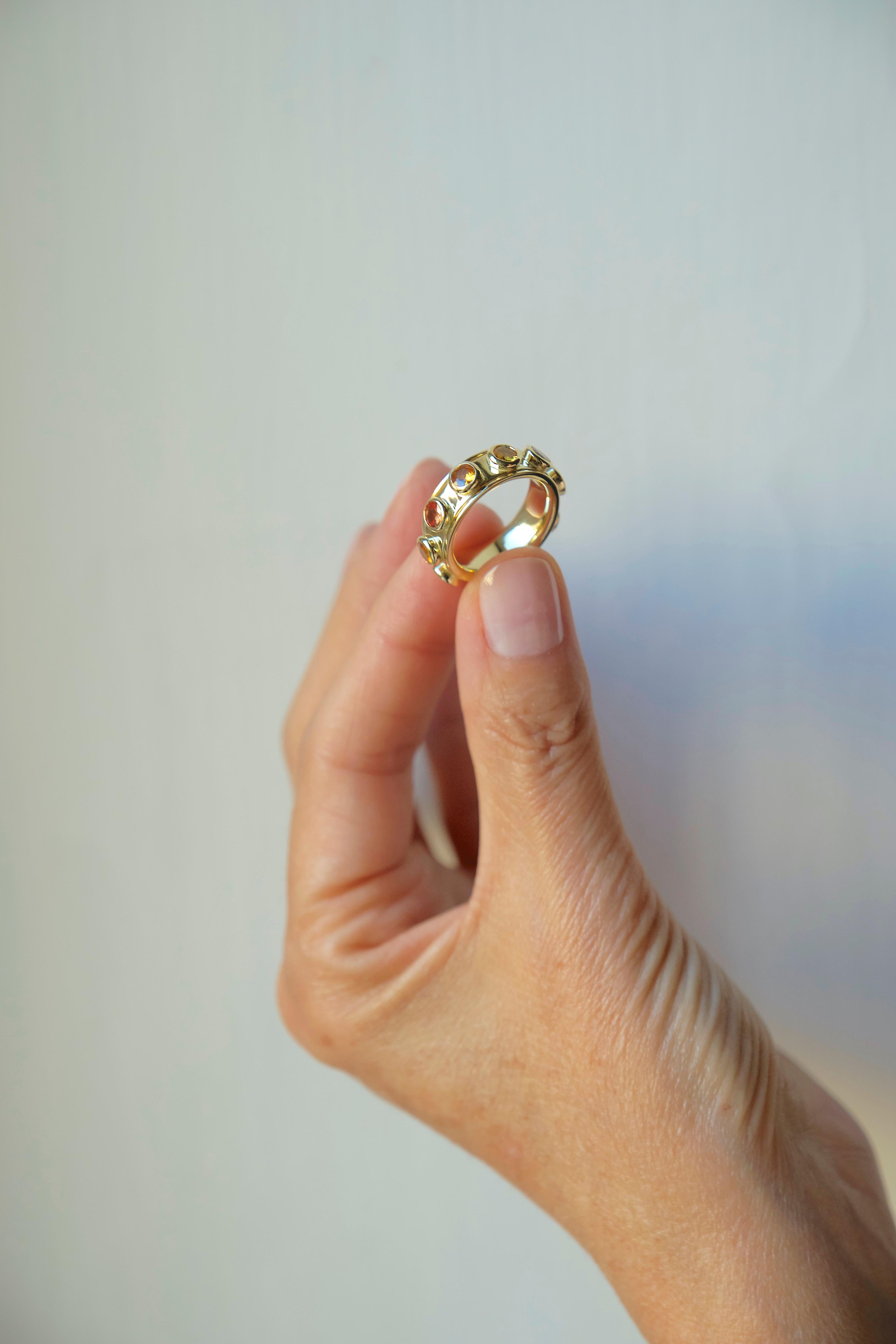 Crafted by Rossella Ugolini, this 18K yellow Gold ring offers more than simple elegance. It’s an extraordinary wellbeing tool designed with a rotating band adorned with stunning Yellow Sapphires in a gradient of captivating hues.
 Handmade with