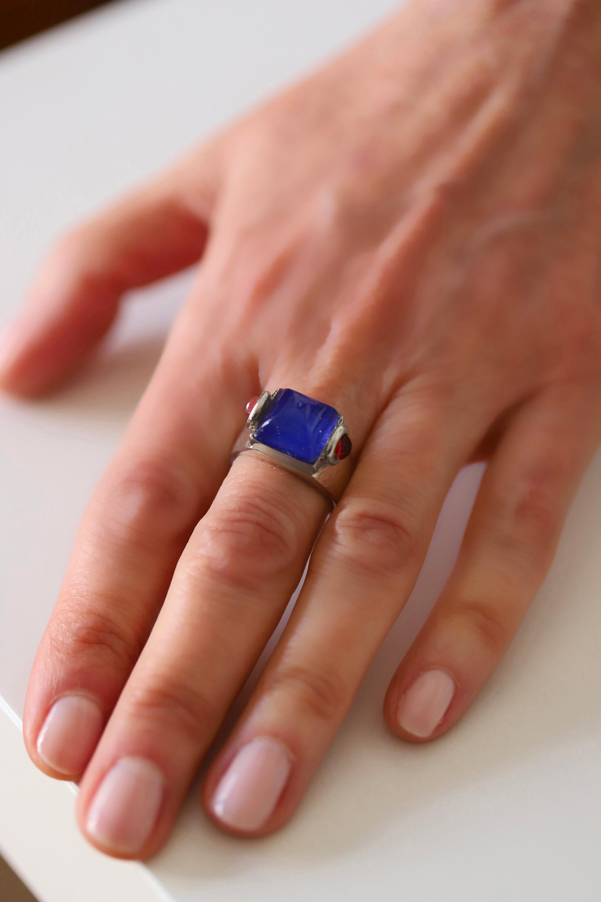 Rossella Ugolini's Castle of Italy design collection, meticulously handcrafted in Platinum featuring a striking lapis lazuli and rock crystal sugarloaf cabochon accented by two cabochon Red Rubies . This exceptional craftsmanship, originating from