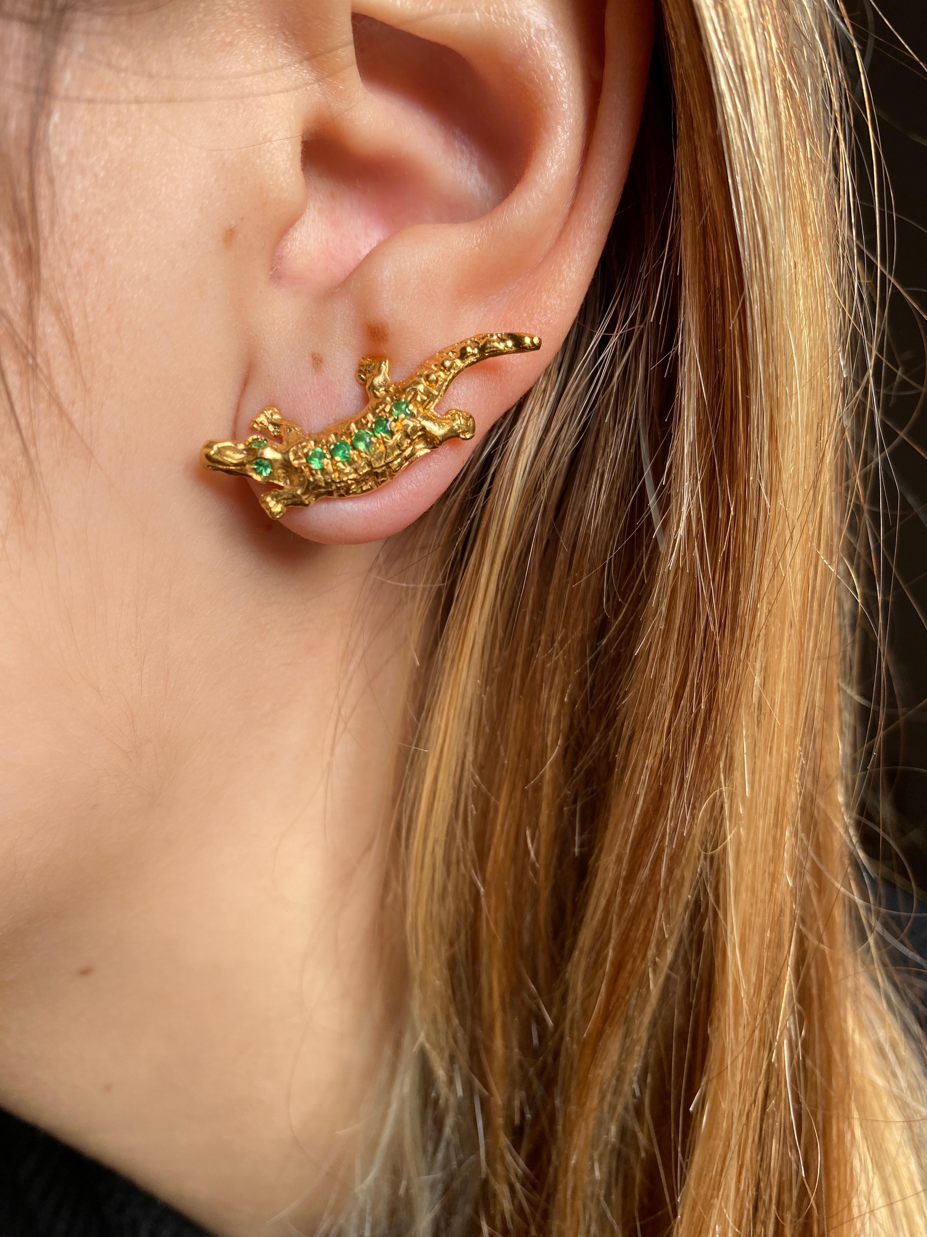 Introducing the Rossella Ugolini Alligator Stud Earrings, a seamless fusion of wild allure and timeless elegance. Handcrafted in Italy, these unisex earrings feature a captivating design – one alligator faces upward, while the other gracefully gazes