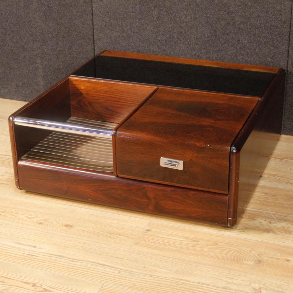 Rossi di Albizzate design coffee table from the 1980s. Italian furniture of particular construction in wood, matte glass and chromed metal. Coffee table for living room with compartment with internal mirror and different shelves. Furniture mounted