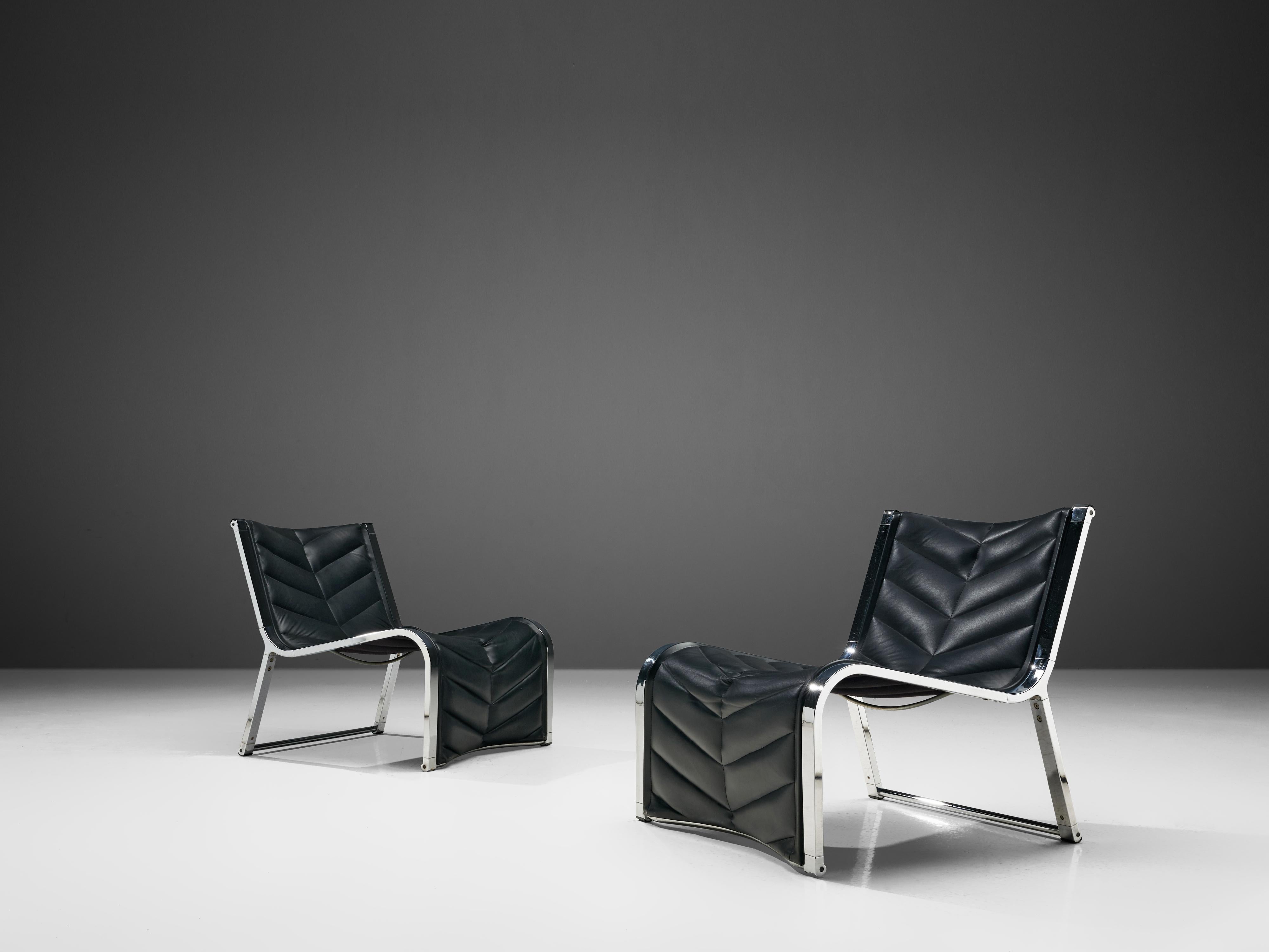 Rossi di Albizzate, pair of easy chairs, black leather and chrome, Italy, 1970s. 

Beautiful esthetically balanced chairs produced by Rossi di Albizzate. The use of chrome lays extra emphasis the sleek and elegant forms of the frame. The black