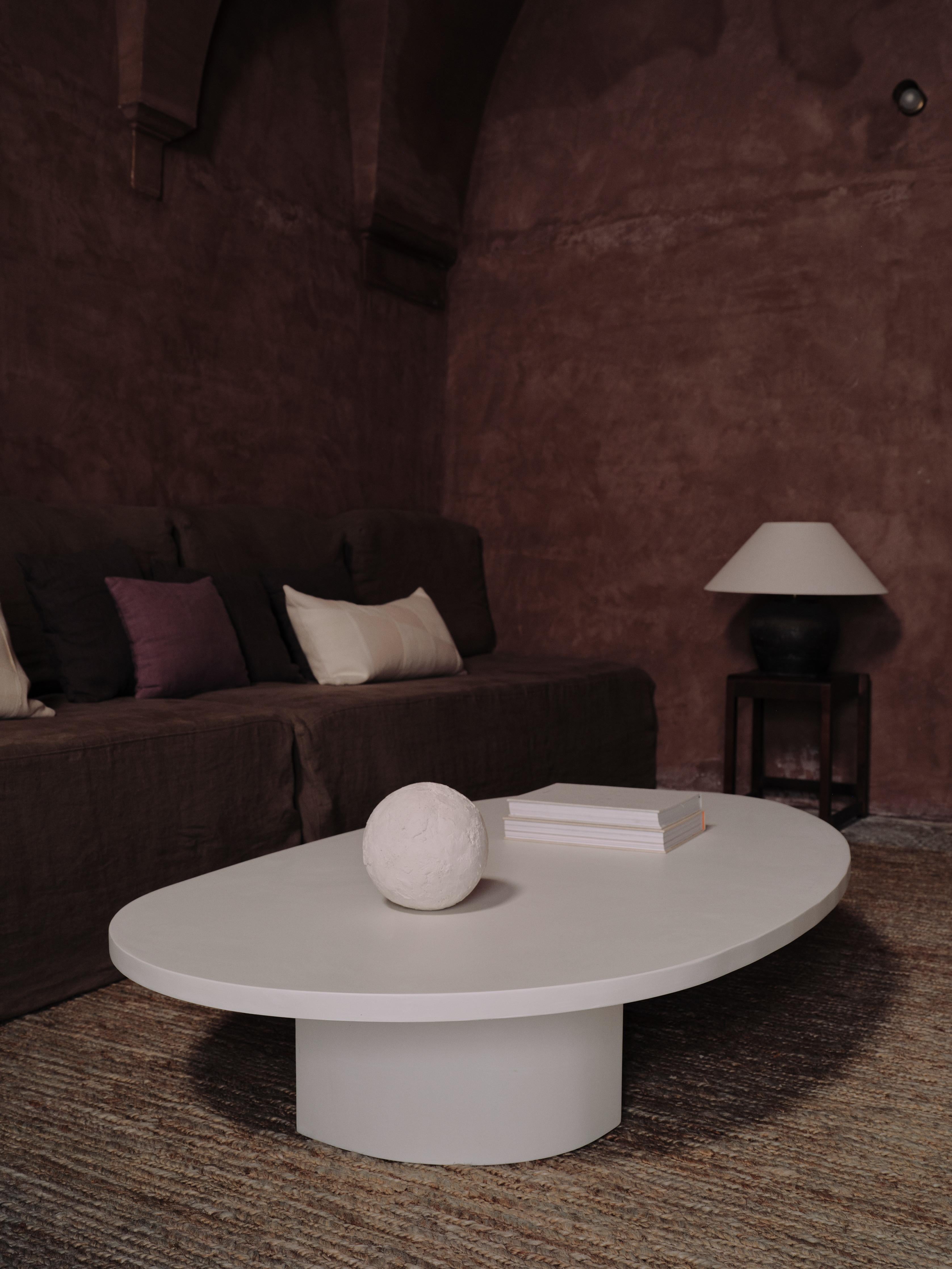 Handcrafted in Spain by expert artisans, this oval-shaped dining table from Marlot Baus combines timeless design with modern craftsmanship. Each piece is carefully made using our signature microcement technique, layered by hand to achieve a smooth,
