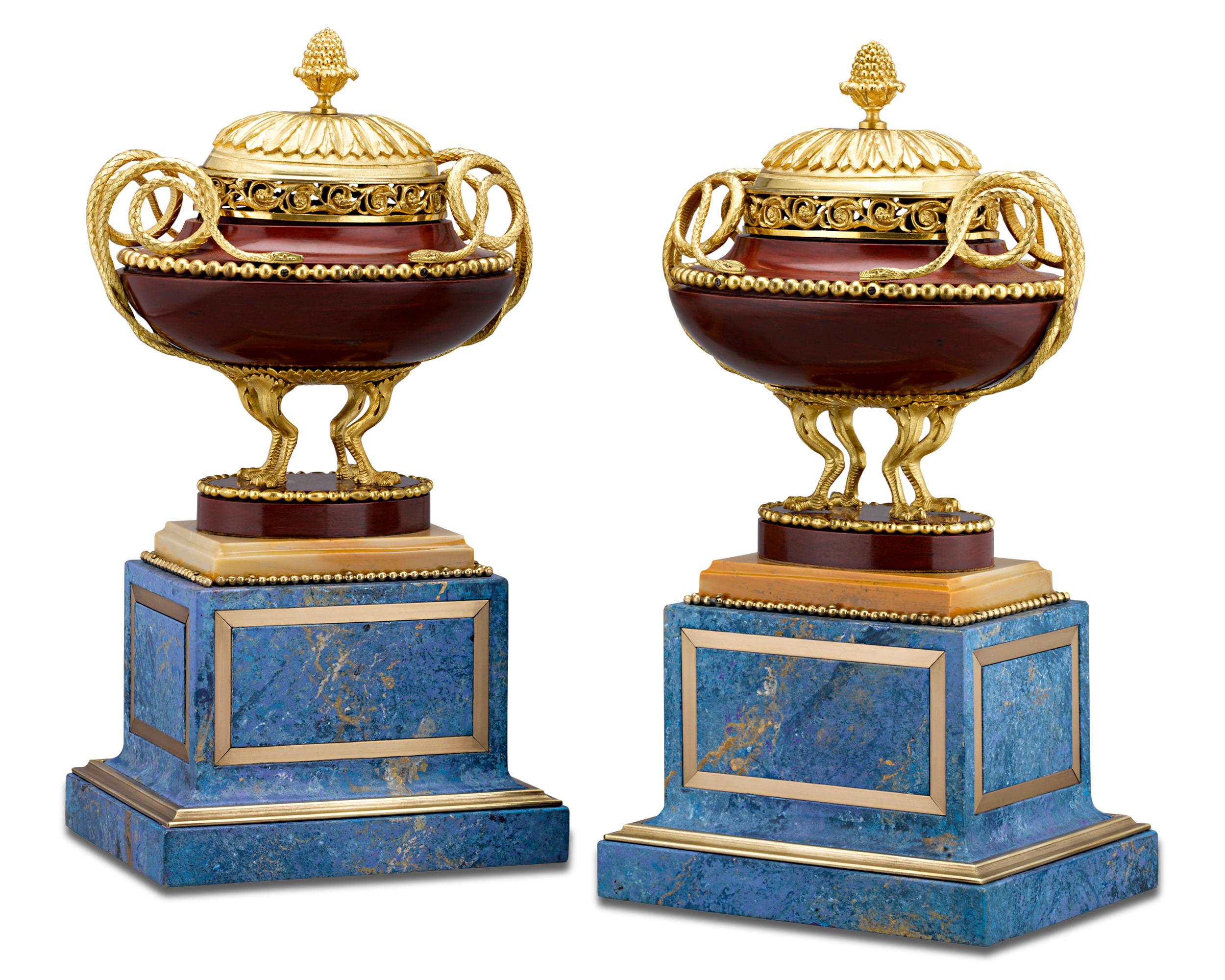 This exquisite pair of rosso antico marble and gilt bronze potpourri vases epitomize opulent artistry. A popular material for sculpture in ancient Greece, Rome and Italy, rosso antico is identifiable by its pink to reddish hue. These vases exhibit