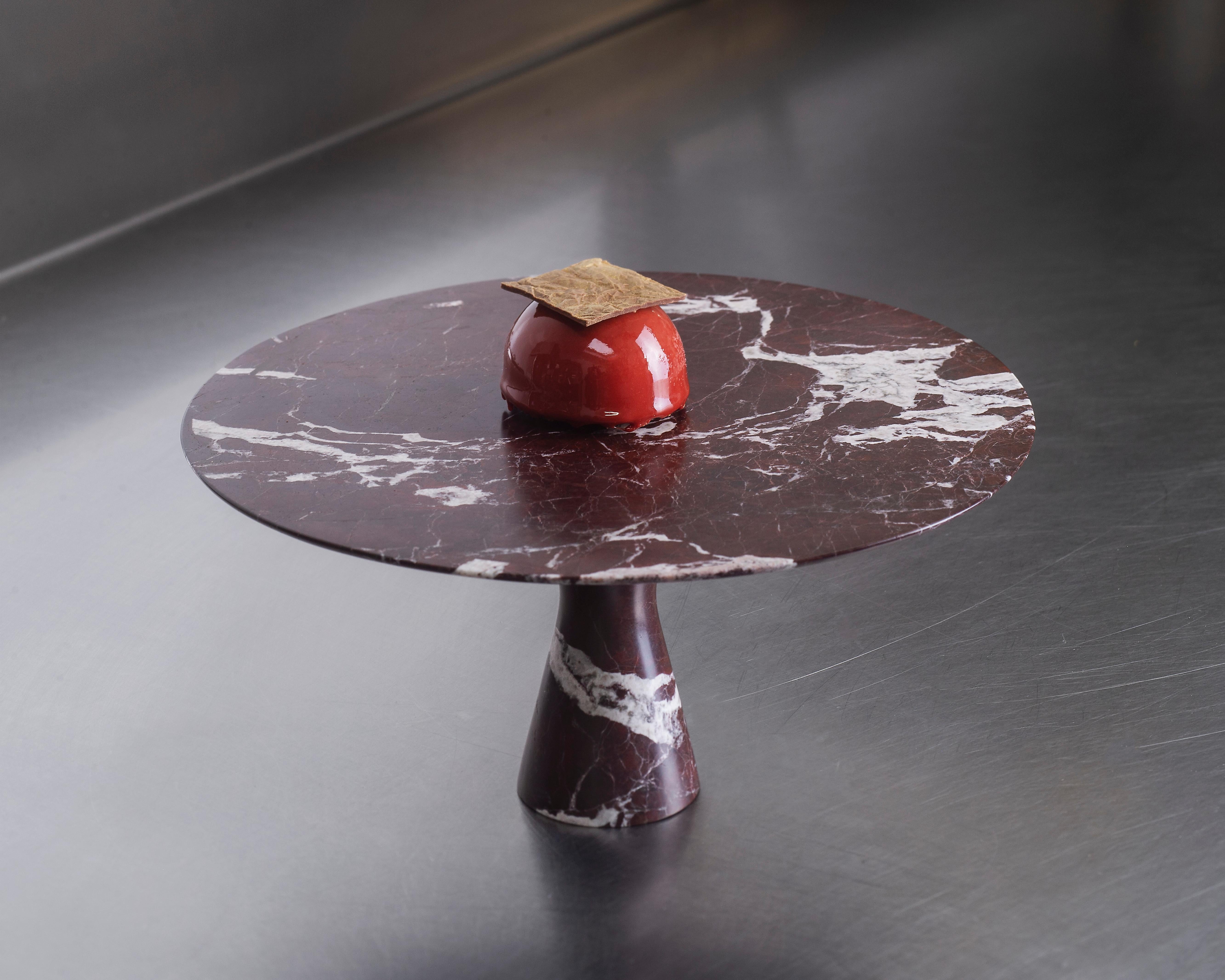 Rosso Lepanto Refined Contemporary Marble Serving Plate
Dimensions:
Ø 32 x 2 cm H
Ø 32 x 15 cm H
Ø 24 x 22 cm H
Angelo O is the little brother and scale model of the natural stone table Angelo M. Angelo O can ideally be used as a cake plate, cheese