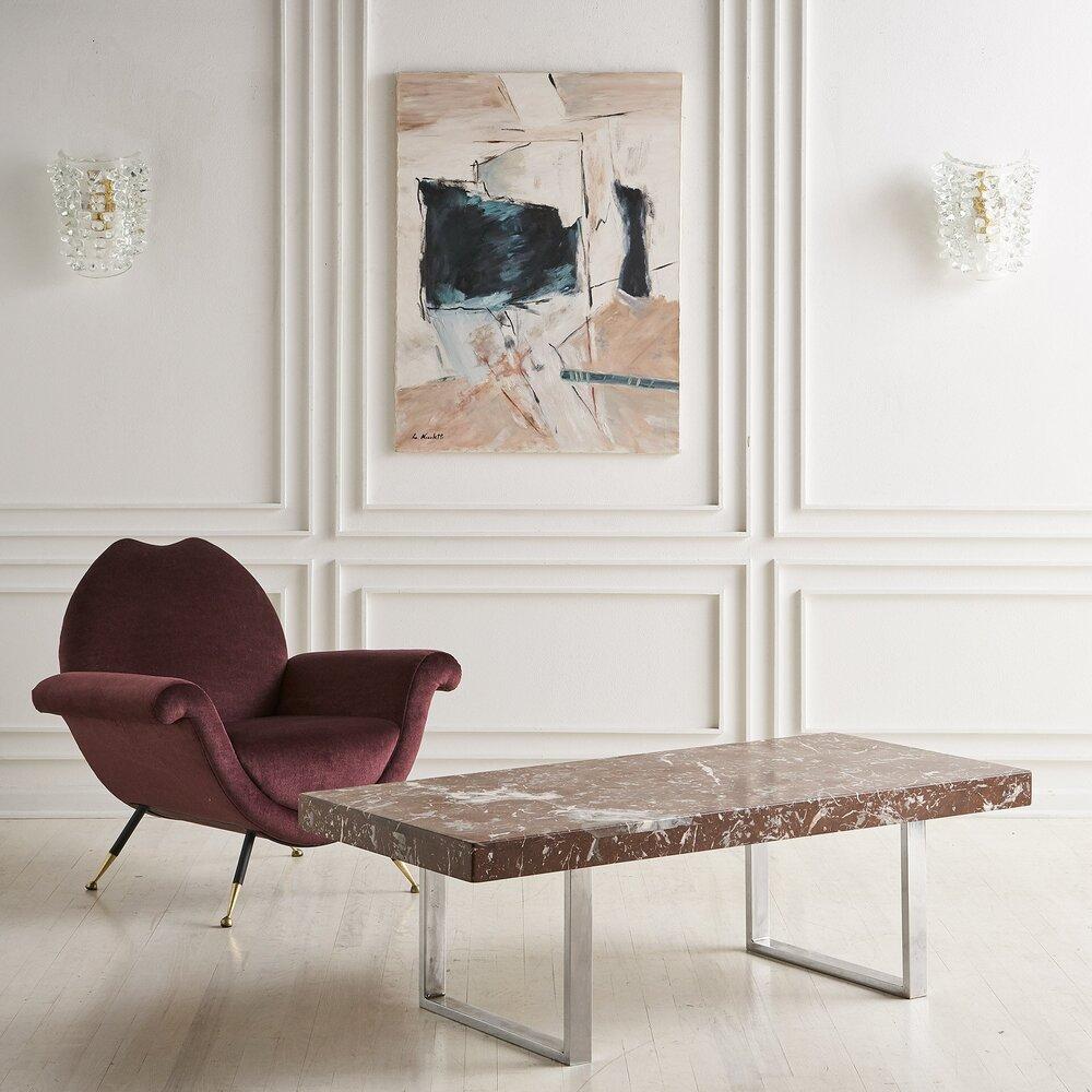 A Rosso Levanto marble coffee table affixed to a chrome base. Beautiful movement and graining in this marble with subtle shades of crimson and brick red, gray and peach. 

Sourced in Europe, 1970s.