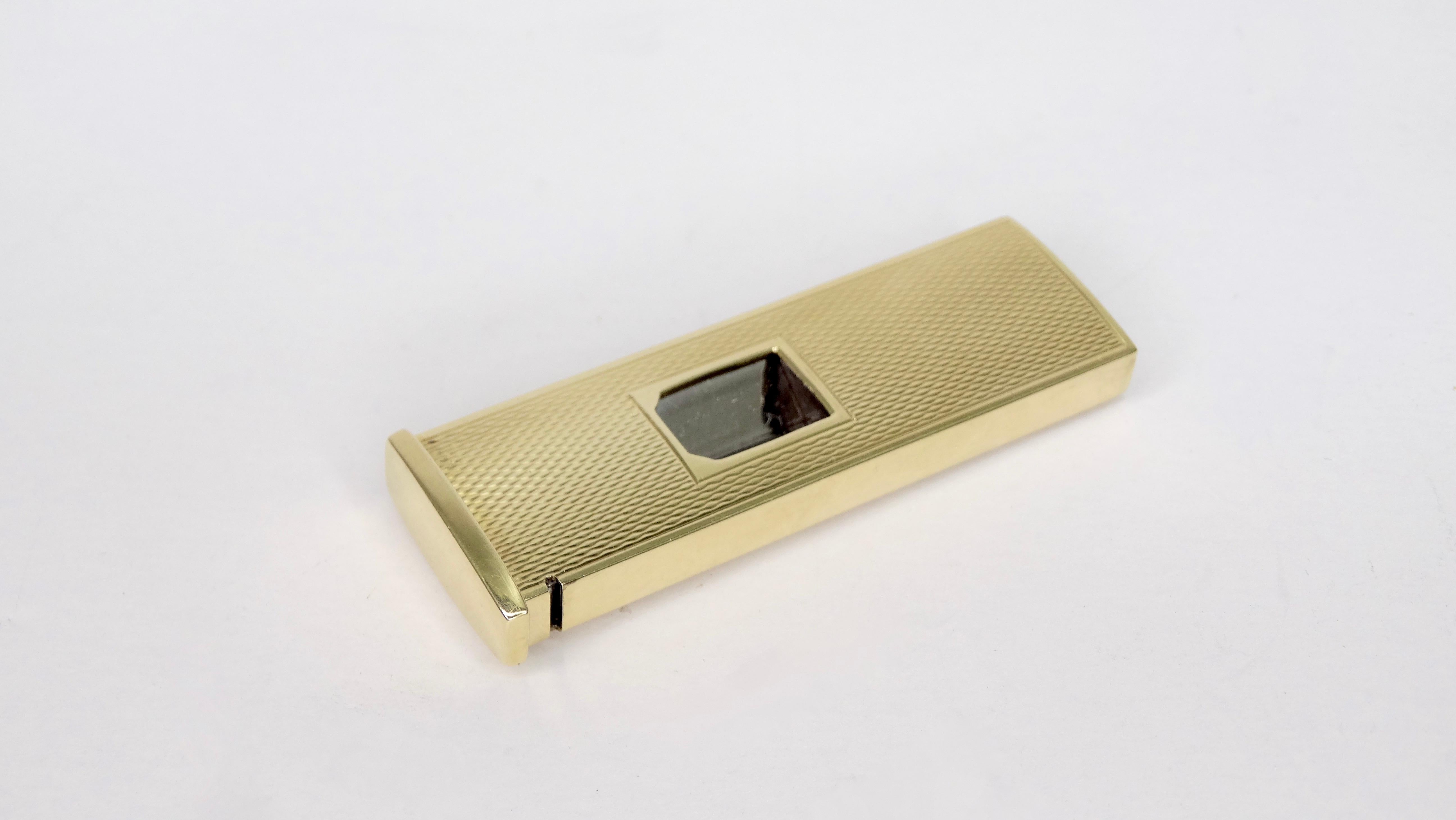Circa 1950s, this German made Rostfrei Pfeilring Solingen cigar cutter is crafted from 14k gold and features a textured exterior. Easily slides open and closed. Stamped 585 and weighs 19g in total weight. A great novelty gift for yourself or someone
