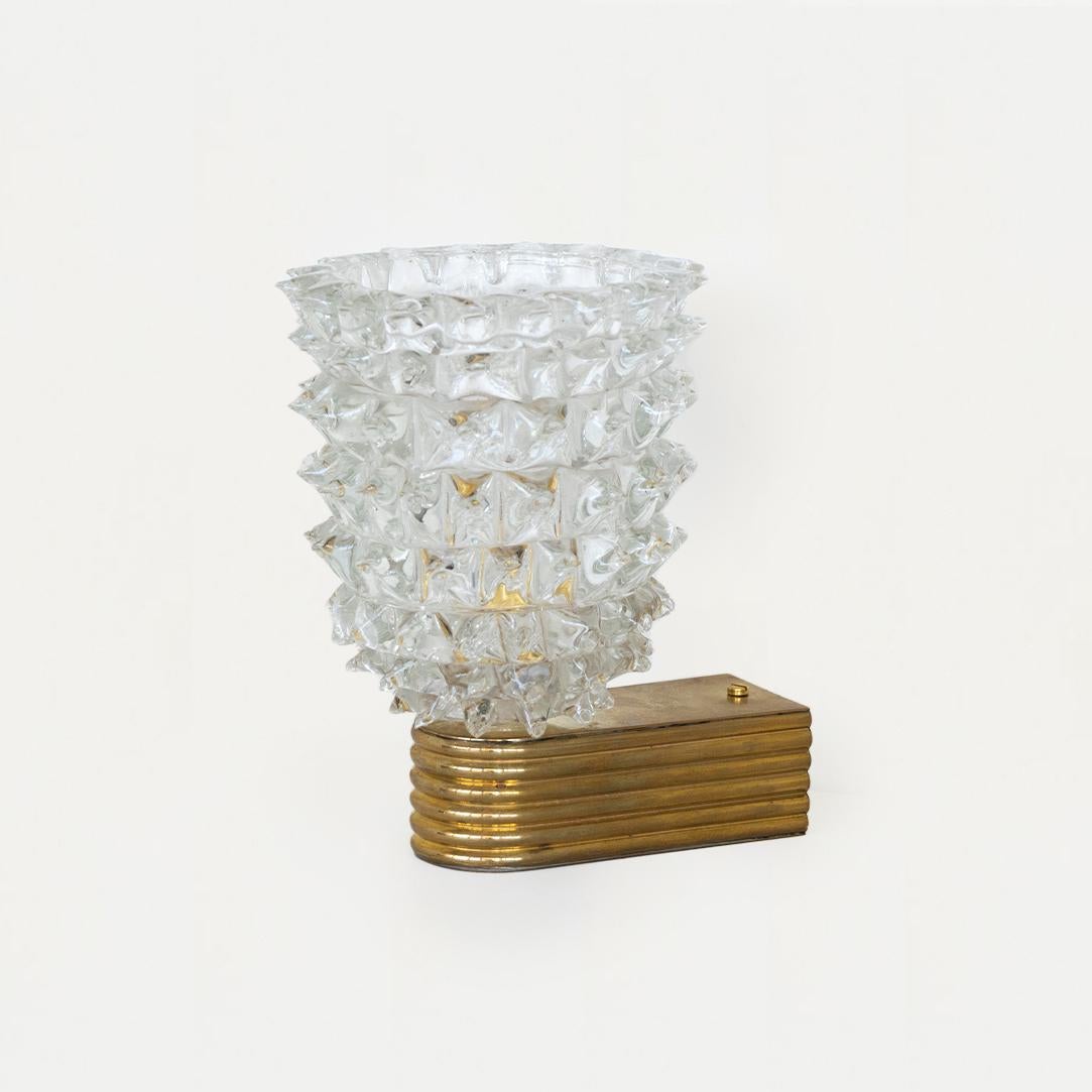 Beautiful single 1940's rostrato sconce with spikey glass by Barovier. Original ribbed brass fixture showing nice age and patina. Newly rewired. Pair also available. 
Original backplate measures 1.75