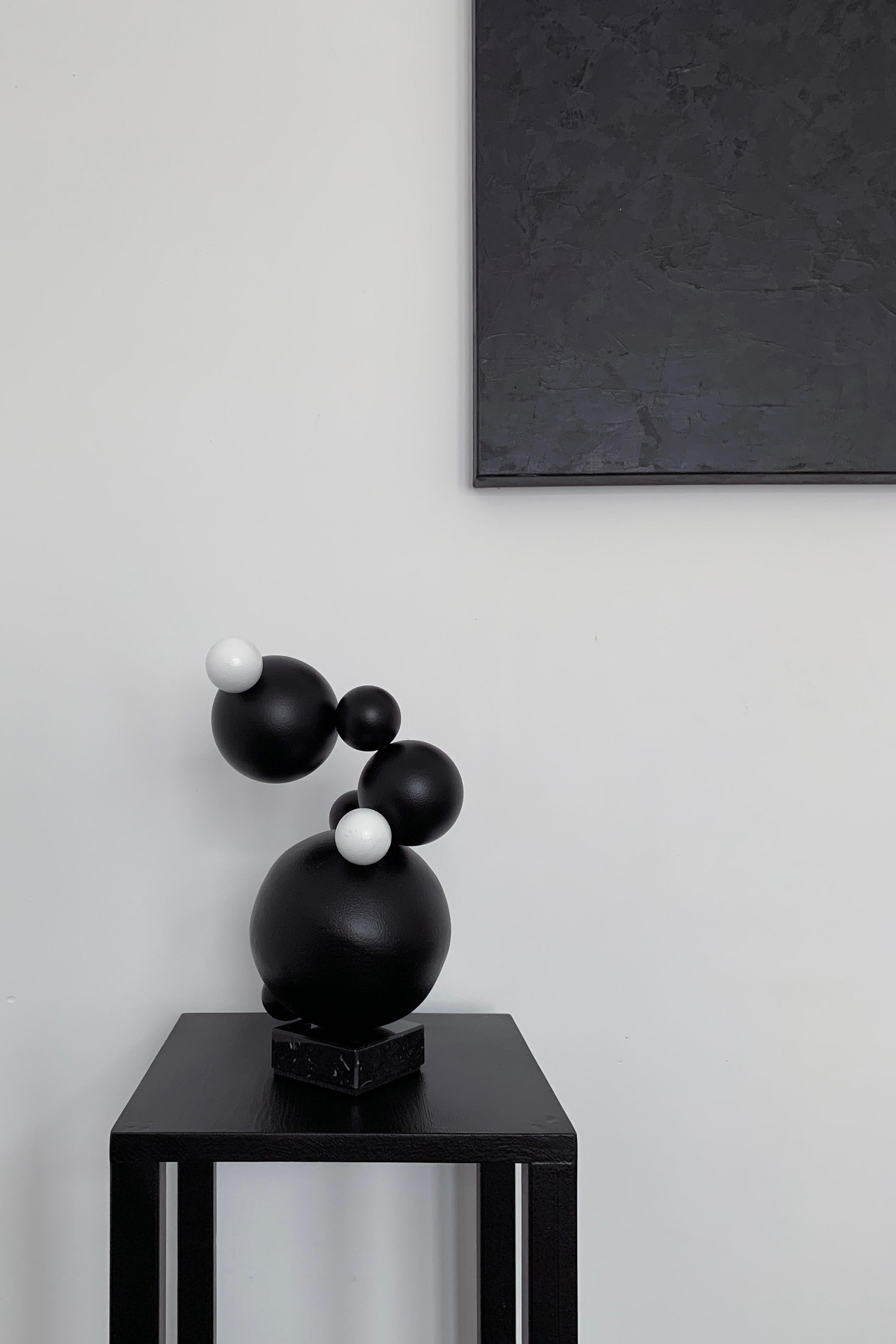 Made in England, 2021.
By Irena Tone and Ros Kozhman.

Steel, acrylic, marble base.

Black. Minimalistic. Abstract. Spheres: from molecules to planets. Look around: mono sphere or billions of small combinations of spheres - this all is our