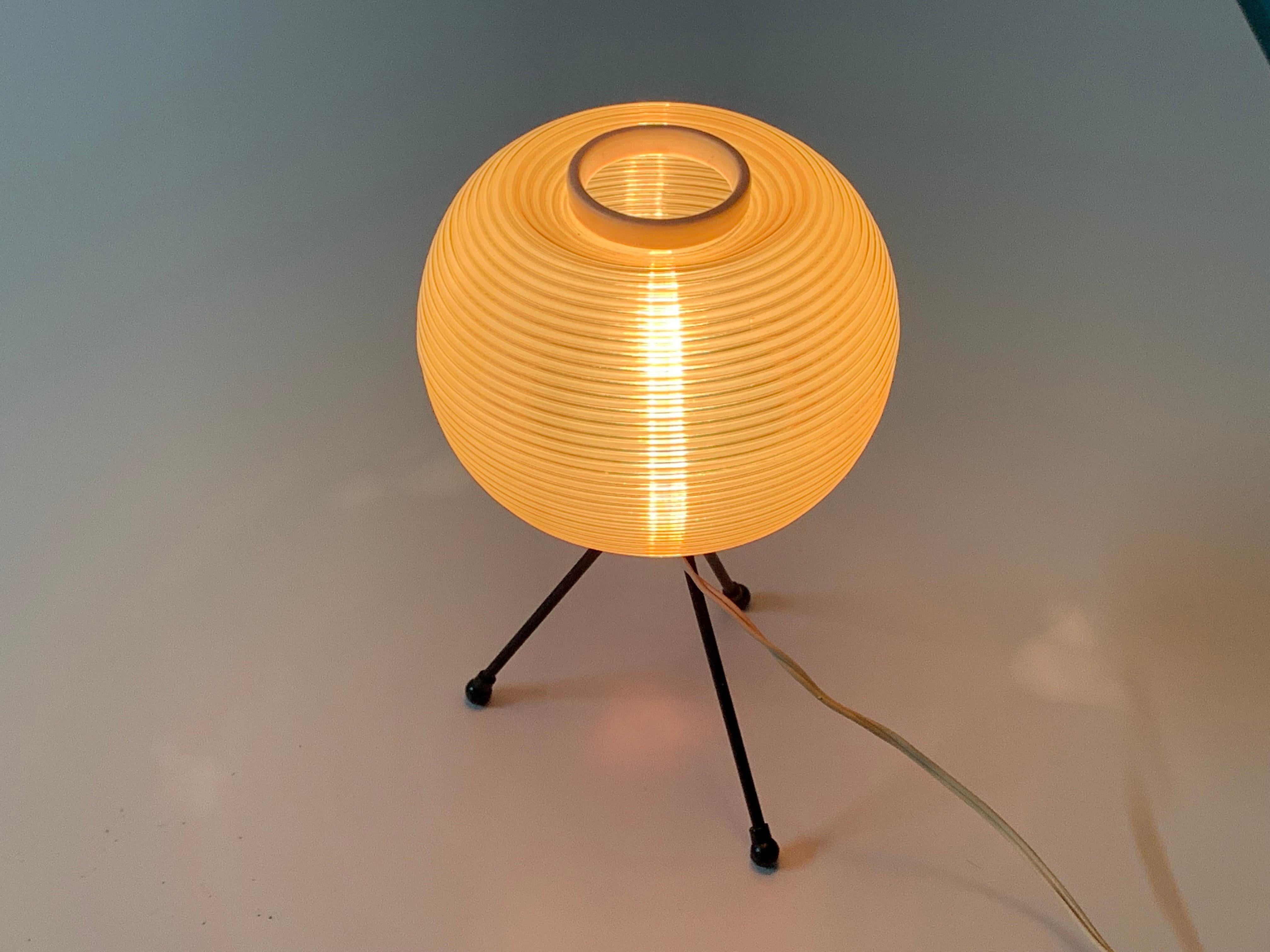 Lamp designed in a very rare style of the french 50s.
The creator is Pierre Guariche (1926-1995), Editor: Disderot
Base in black metal tripod. Support a rotaflex diffuser.
E14 light bulb. Push-button switch.
Bibliography: The Household Art