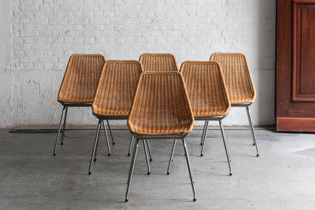 Set of 6 dining chairs designed and produced by Rotanhuis in Holland during the 1960’s. These chairs combine a reed seating with chrome metal legs. A few corners  show a bit of wear, further in good condition. 

H: 79 cm
W: 47 cm
D: 49 cm
Seat