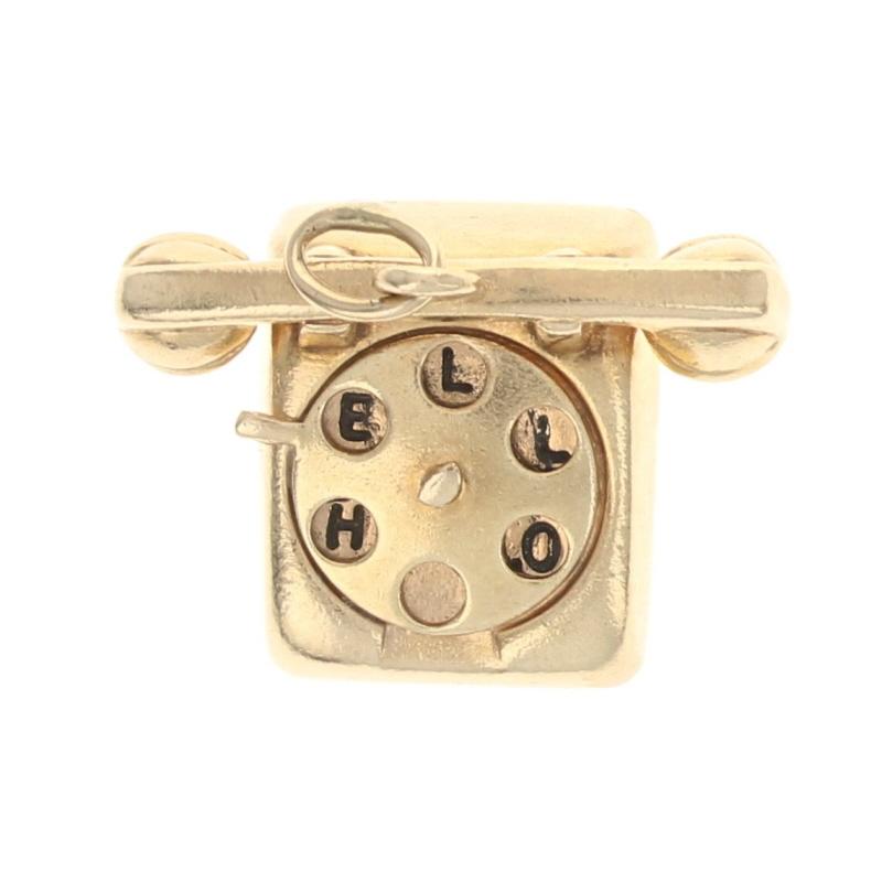 This cute charm features a moveable dial and reveals a little bit of romance!  The telephone has a vintage design and displays a round dial with circular cut outs.  The dial moves in order to reveal two secret phrases.  One position reveals the word