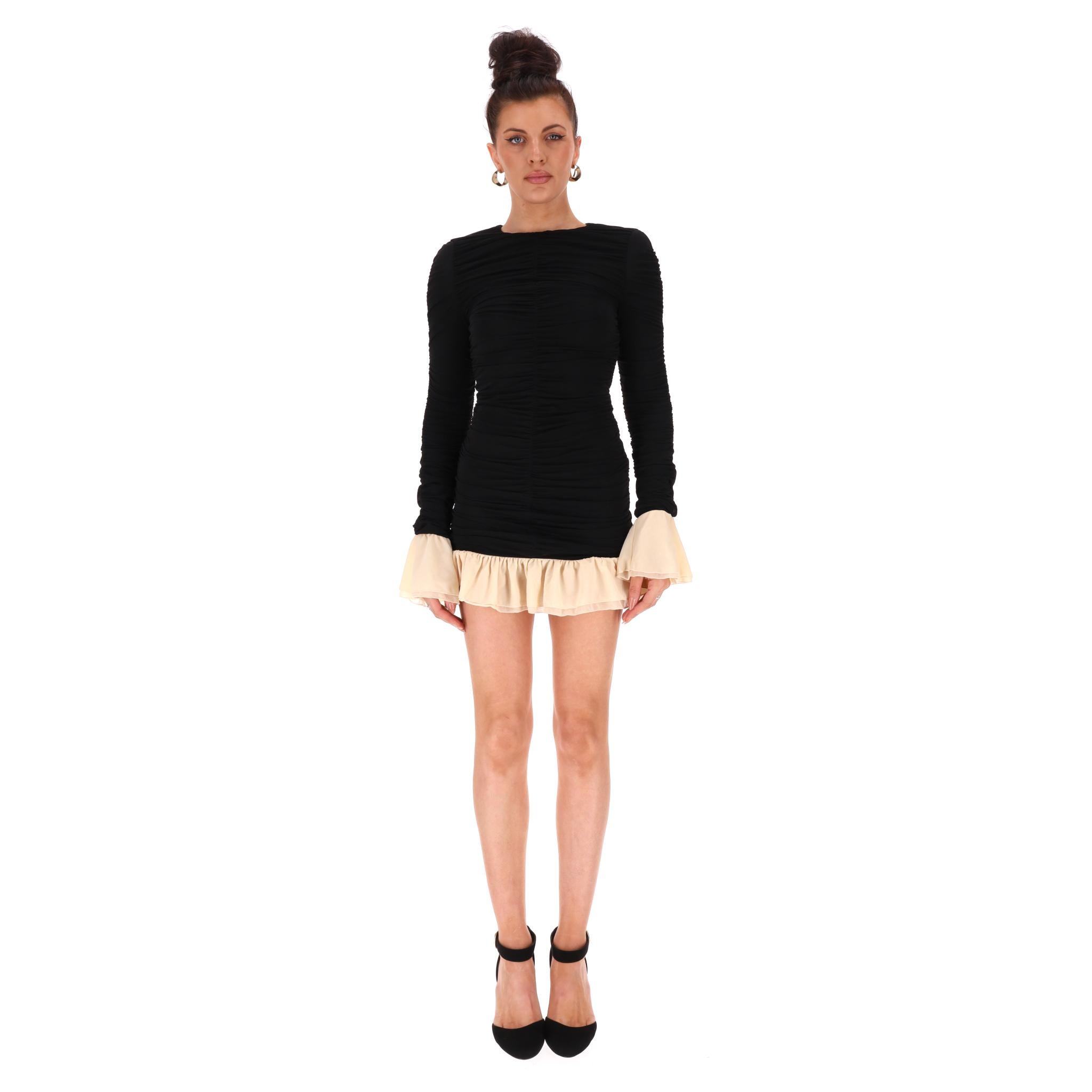 Rotate Ruffle Trimmed Ruched Mini Dress

Black mini dress designed in all-over ruched detailing.

Featuring contrasting ivory ruffle trimmed sleeves and hem.

Fitted silhouette with concealed 'R' zipper fastening to rear.

Rrp Approx. £270

Size –