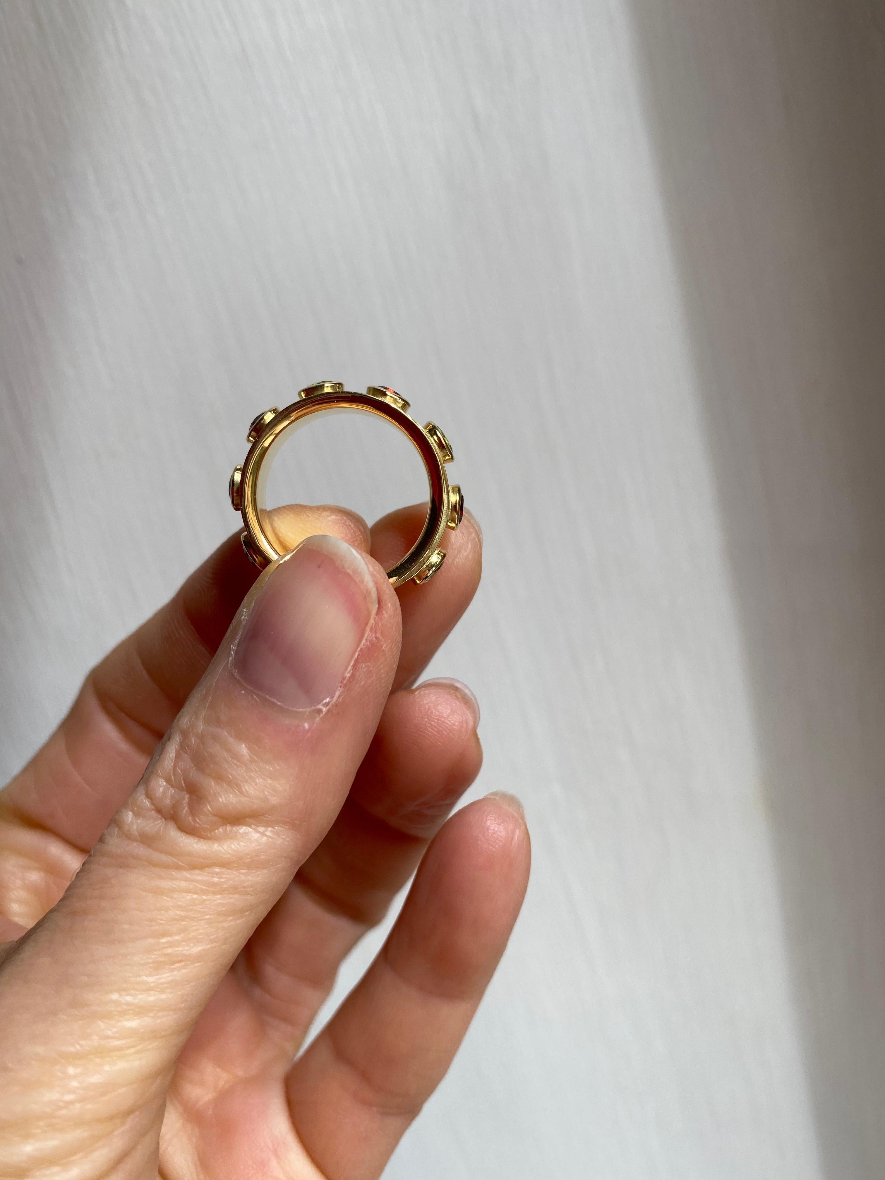 Oval Cut Rotating Band Ring 18 Karats Yellow Gold Garnet Peridot Design Ring For Sale