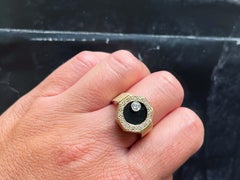 Rotating Diamond Ring on Black Onyx with Diamond Halo in 14k Yellow Gold