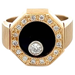 Rotating Diamond Ring on Black Onyx with Diamond Halo in 14k Yellow Gold