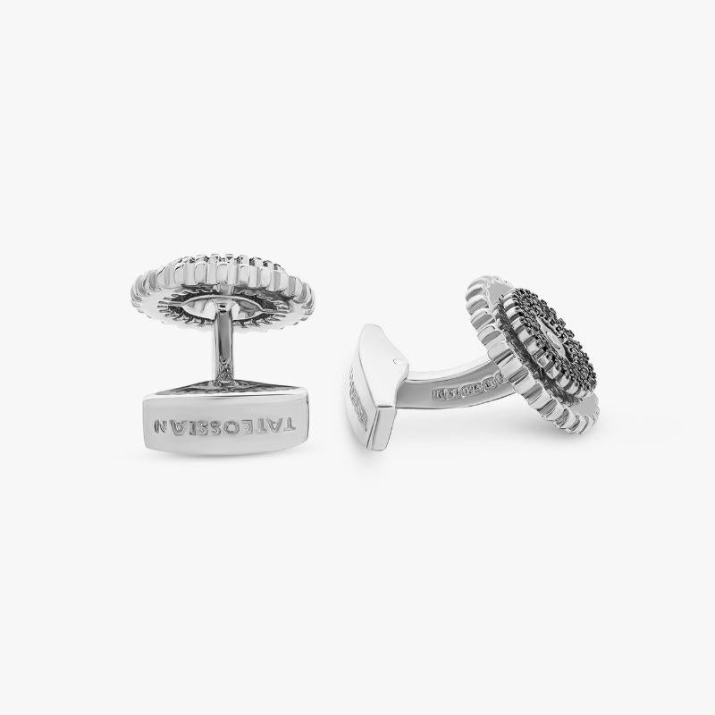 Rotating Gear Cufflinks with Black Diamond in Sterling Silver

An incredible, pave diamond collection of cufflinks, pins and bracelets, revealing a secret movement, or chamber within. Black, white or blue diamonds sparkle over the surface of the